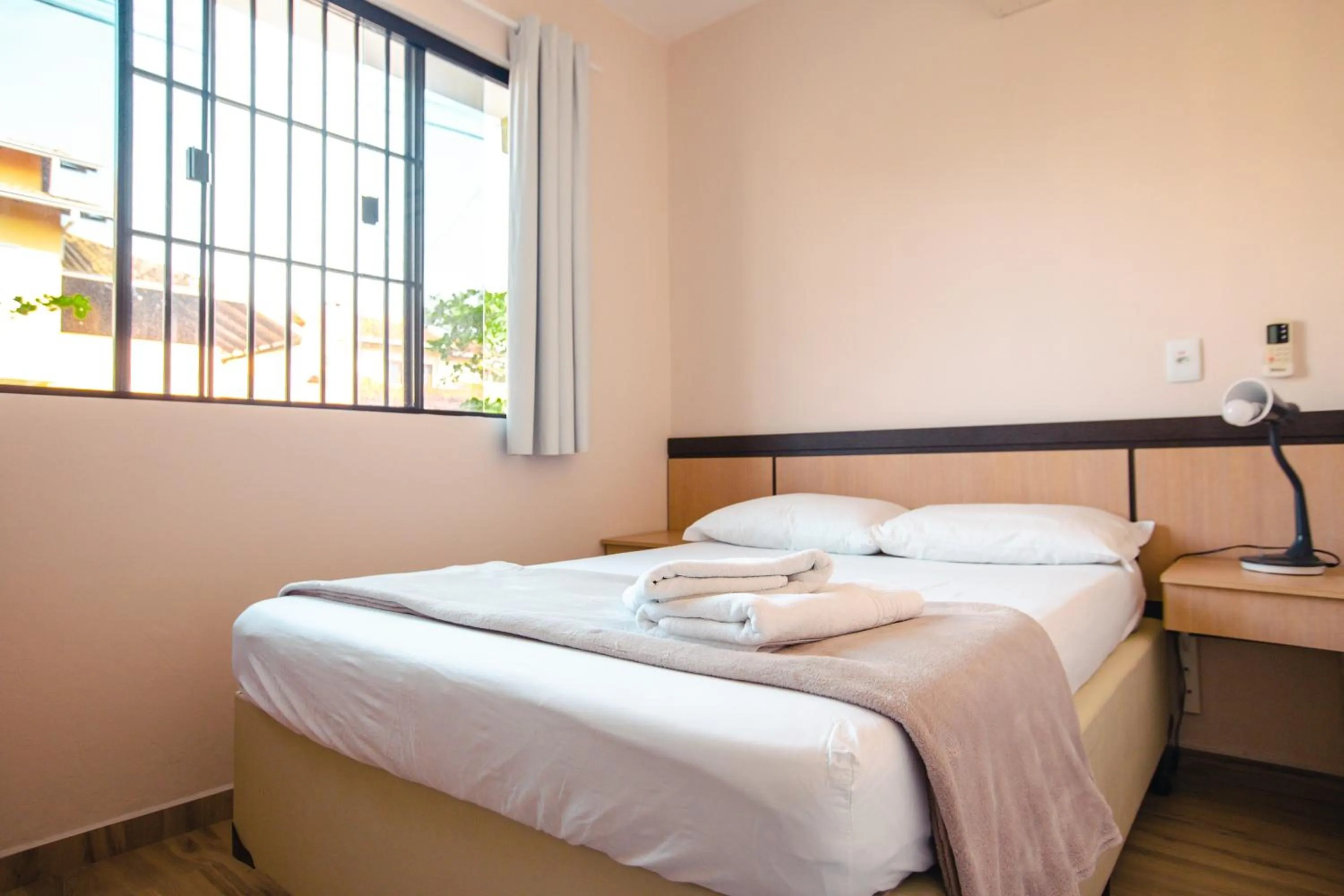 Bed in ApartPousada Residencial dos Reis