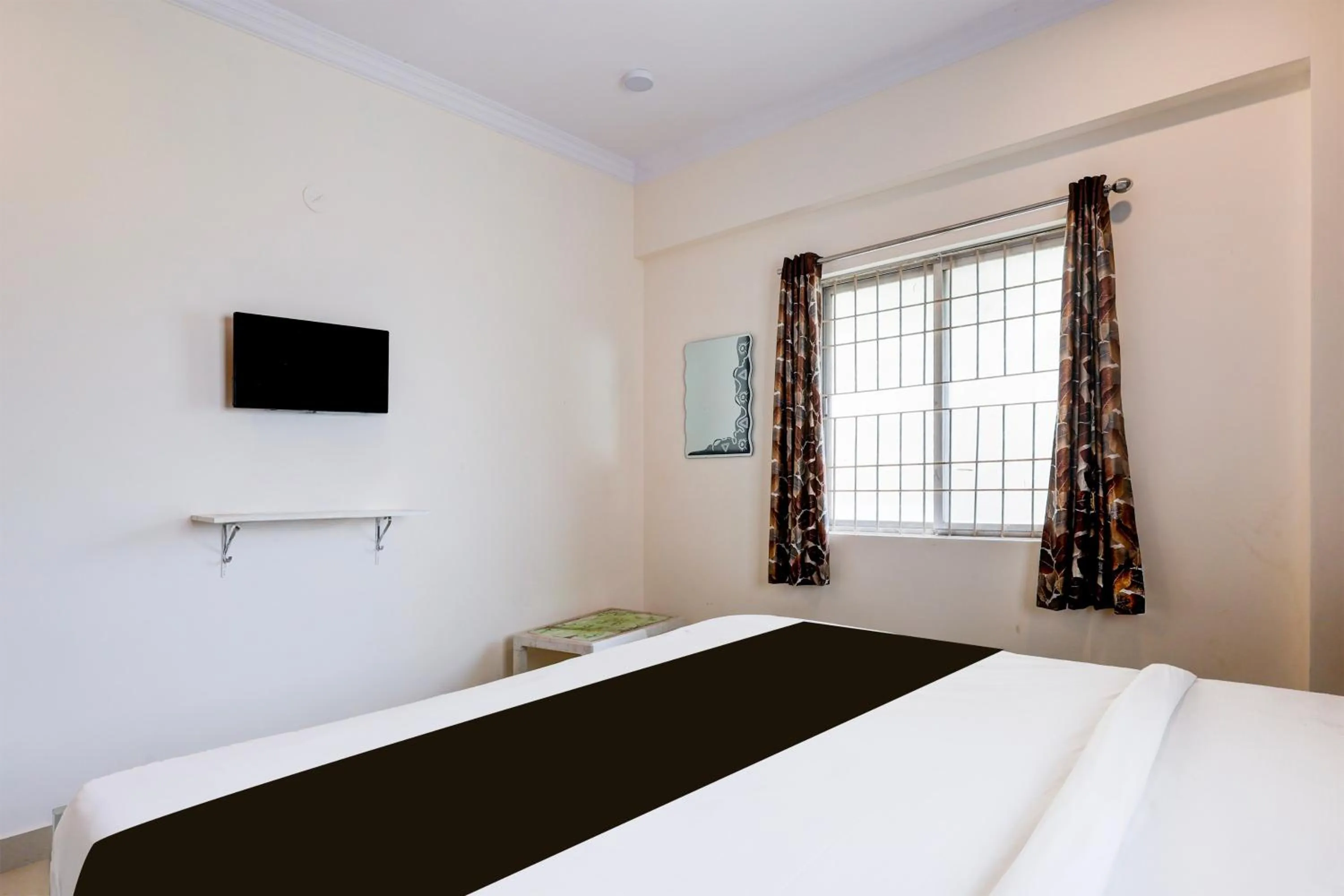 Bedroom, Bed in Super Hotel O Rushikonda Beach