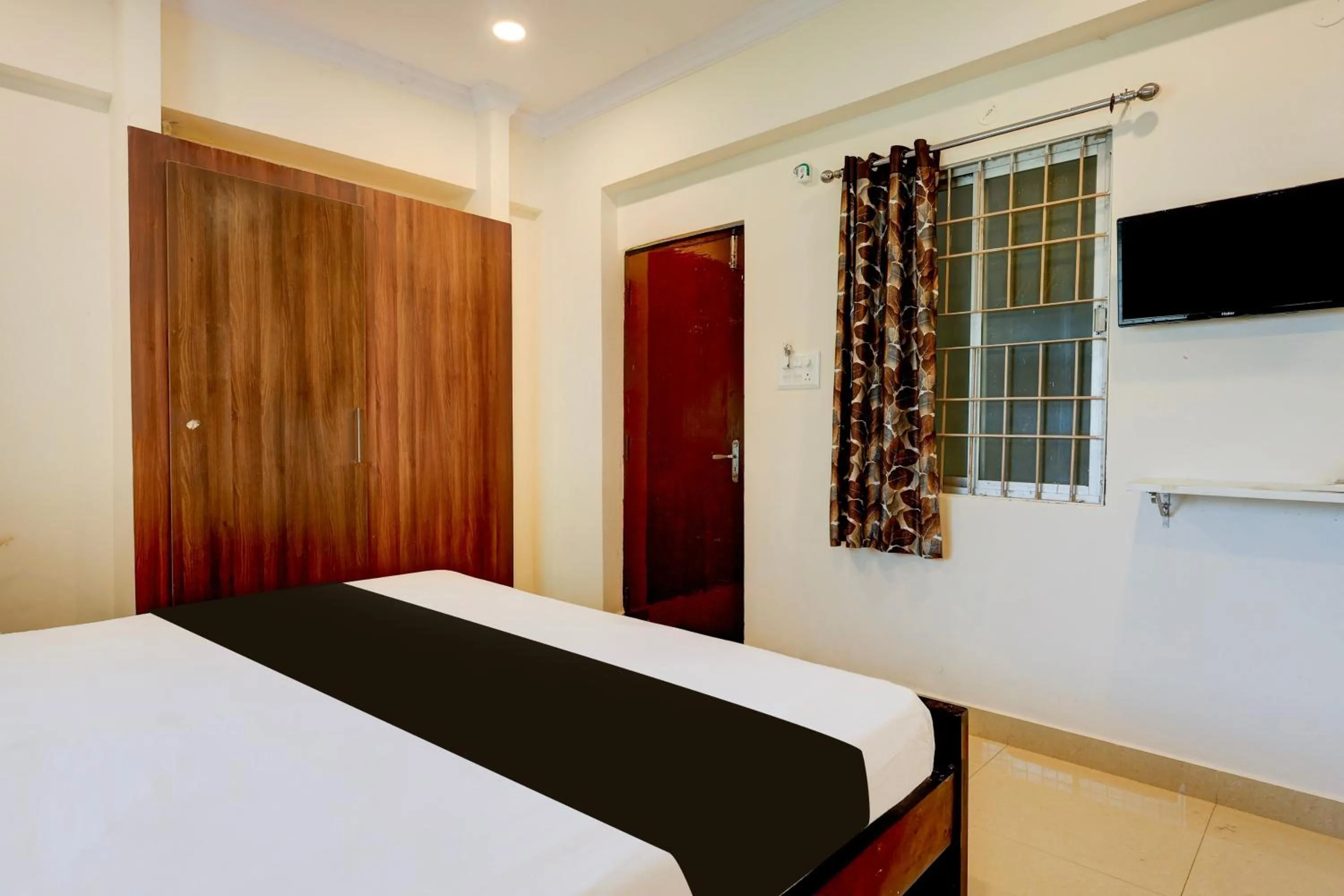 Bedroom, Bed in Super Hotel O Rushikonda Beach