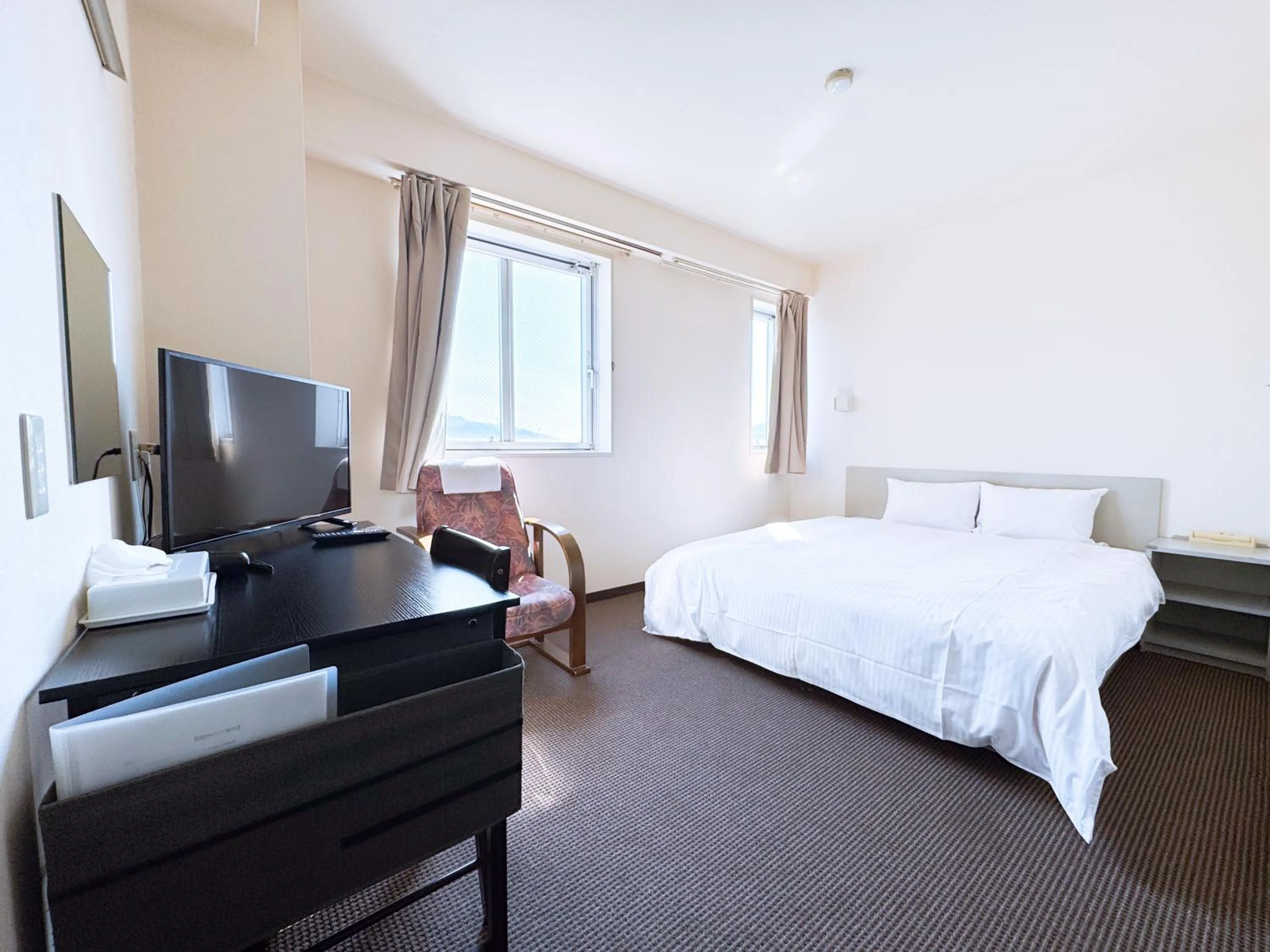 Bed in Uwajima Oriental Hotel