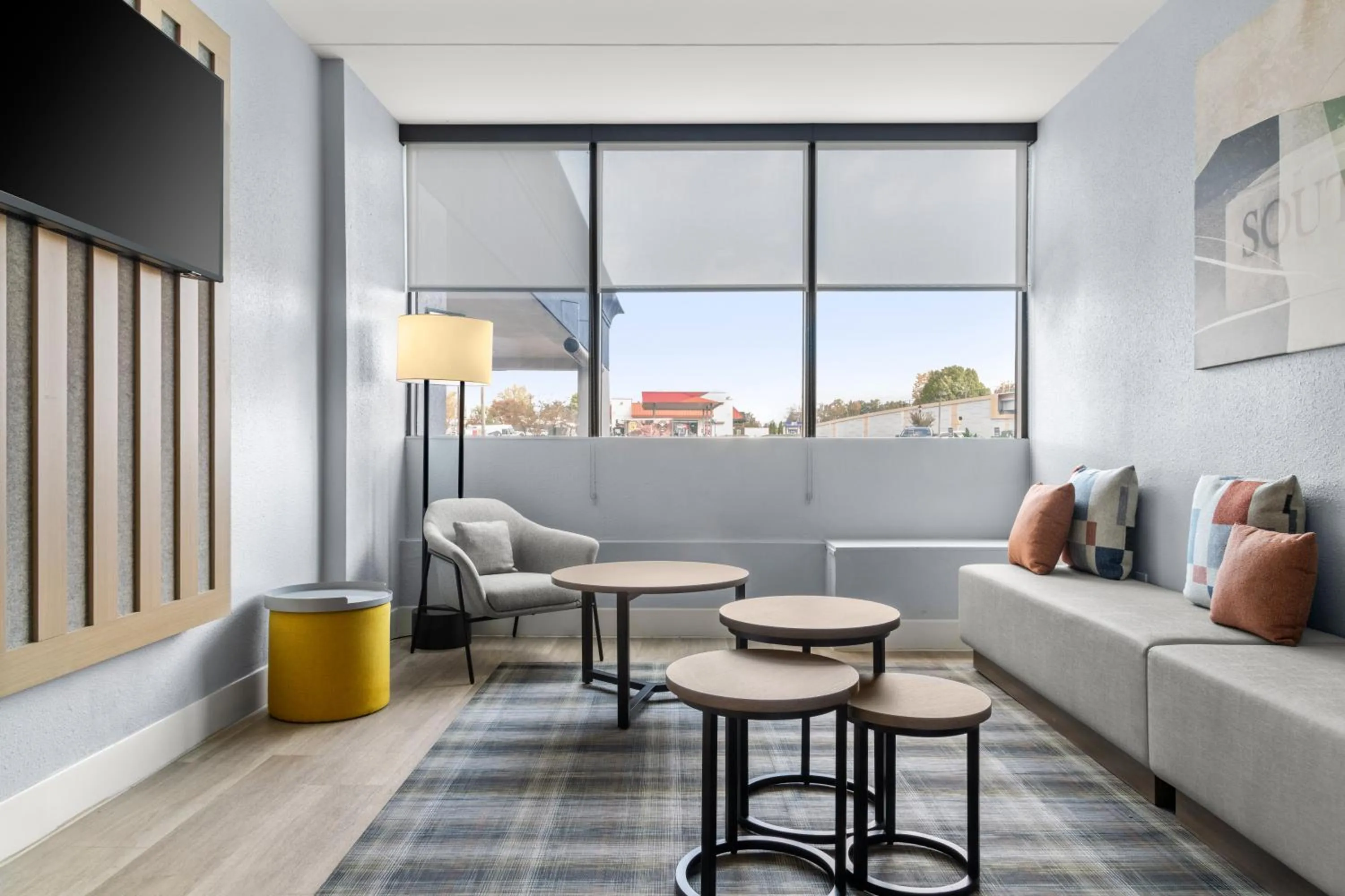 Communal lounge/ TV room in City Express by Marriott Charlotte South End