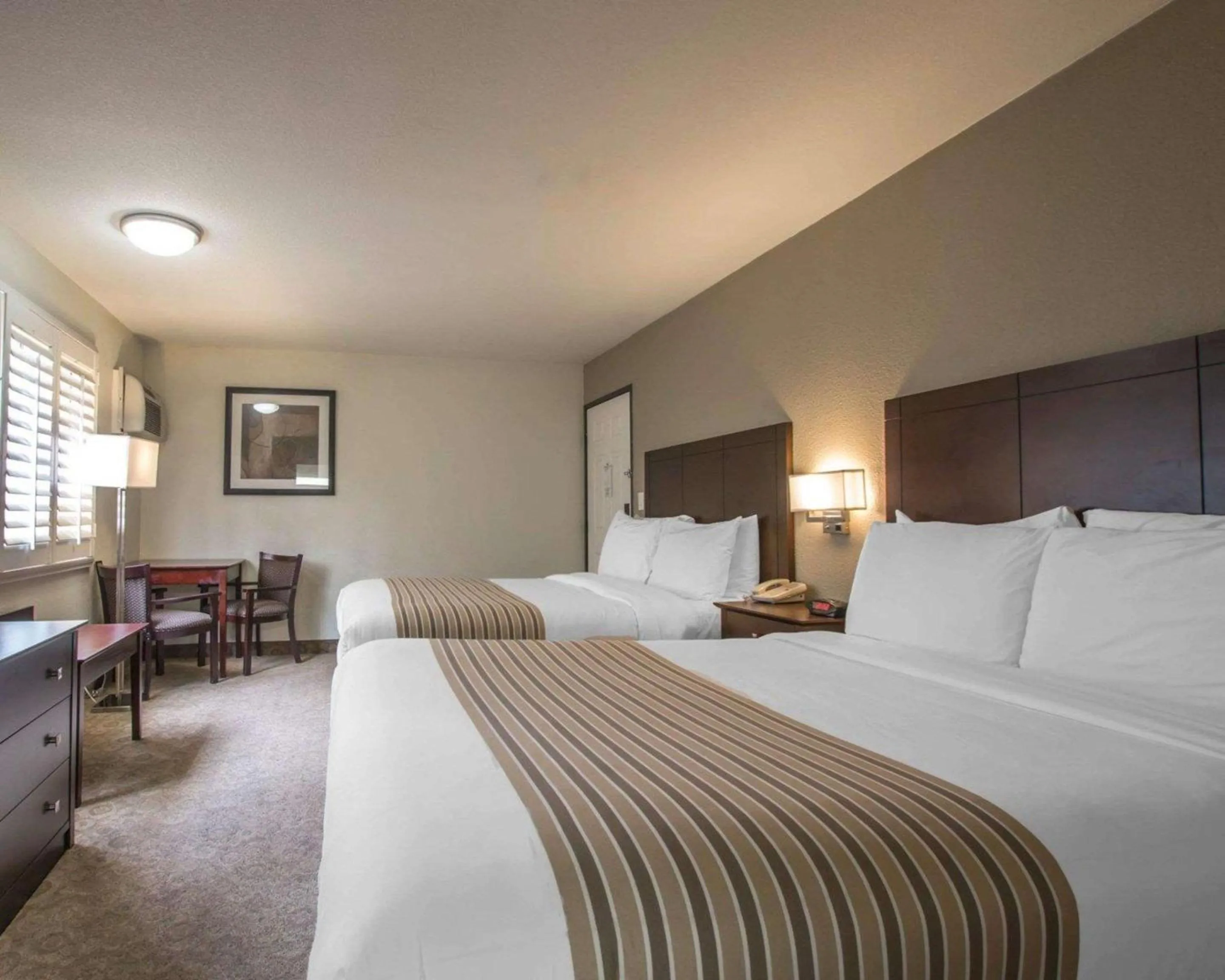 Photo of the whole room, Bed in Rodeway Inn Convention Center