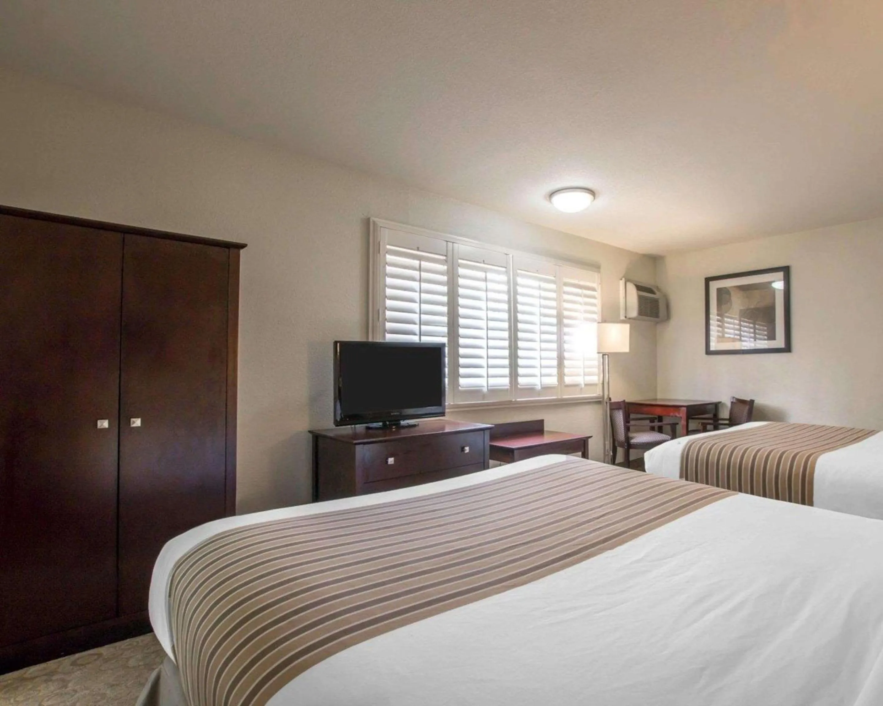 Photo of the whole room, Bed in Rodeway Inn Convention Center