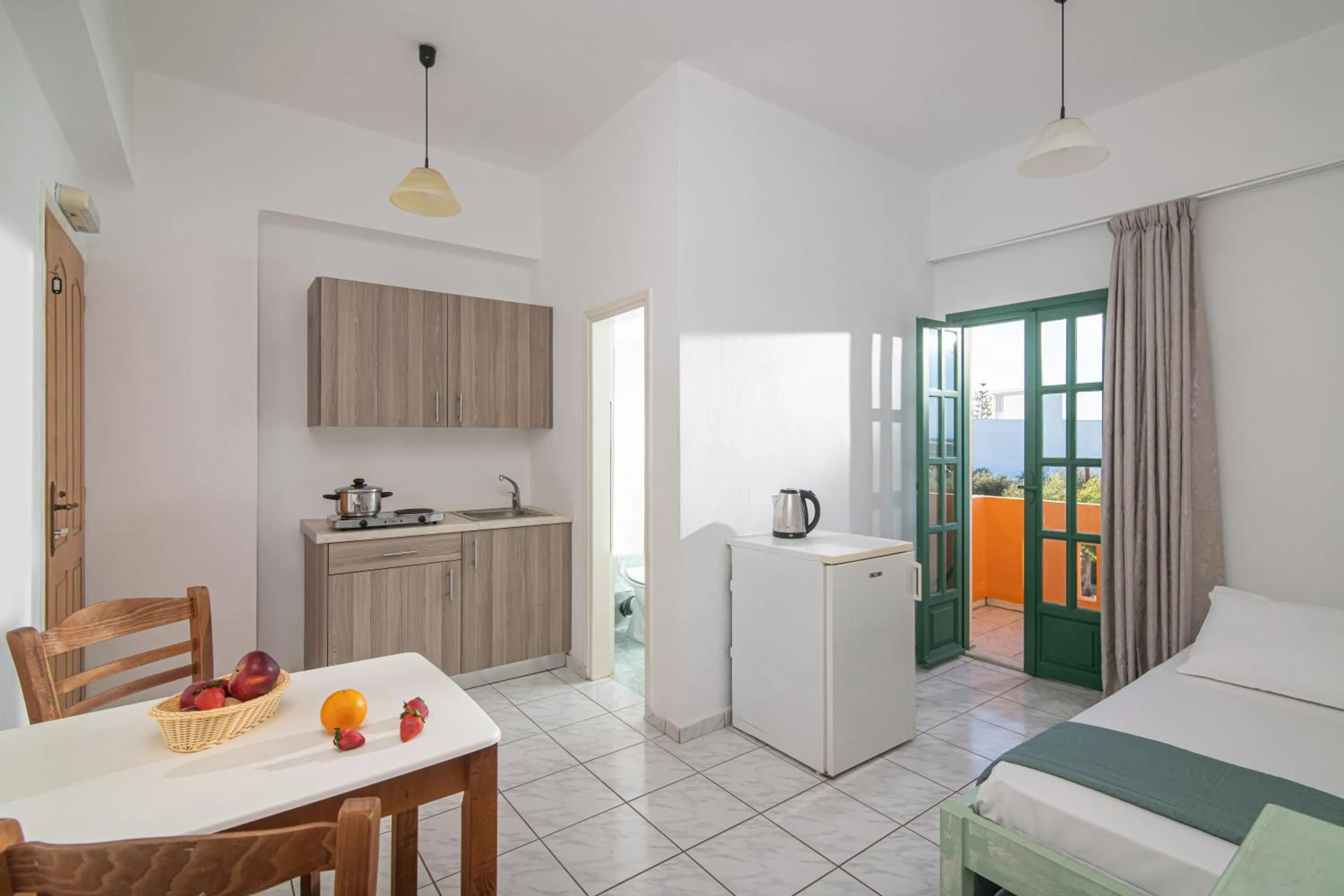 Bed in Portokali Apartments