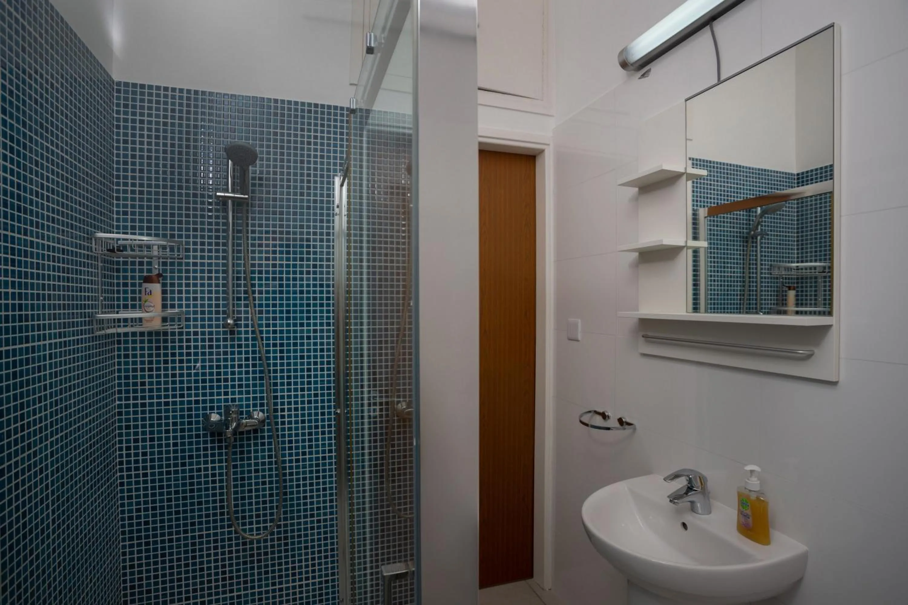 Bathroom in Athenaeum Beachside Apt by TrulyCyprus