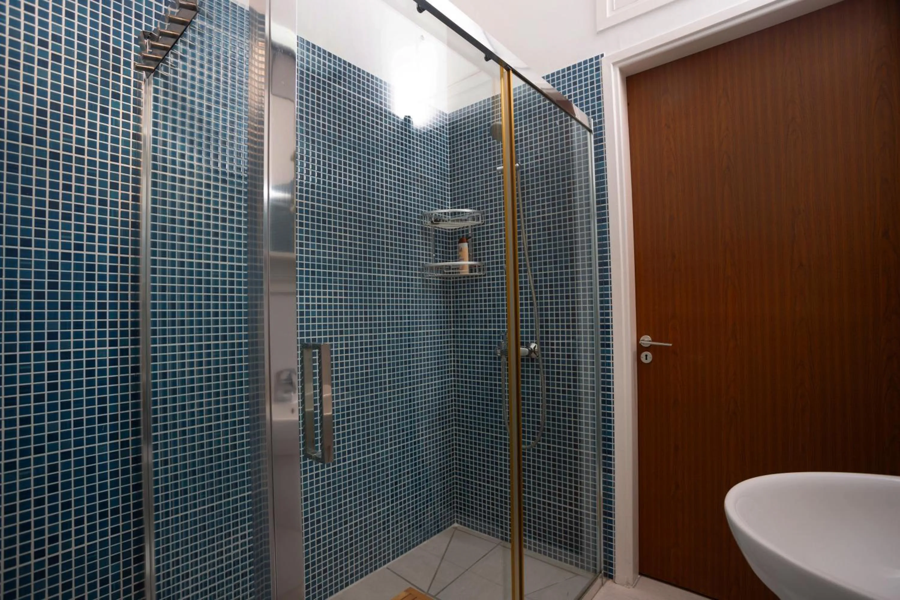 Bathroom in Athenaeum Beachside Apt by TrulyCyprus