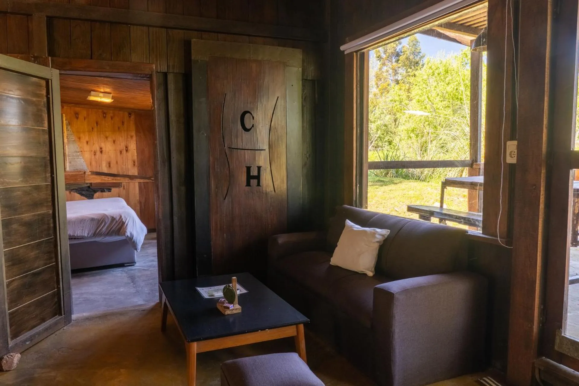 Living room, Bed in Cabañas en el Bosque a 5 minutos del mar - Estancia CH
