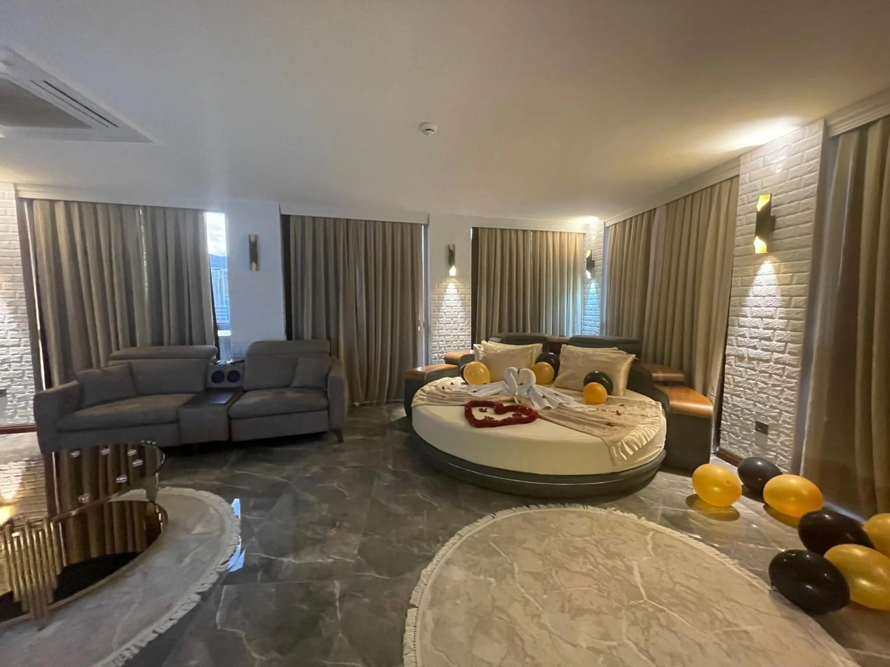 Photo of the whole room, Bed in Le Luxe Suites Hotel