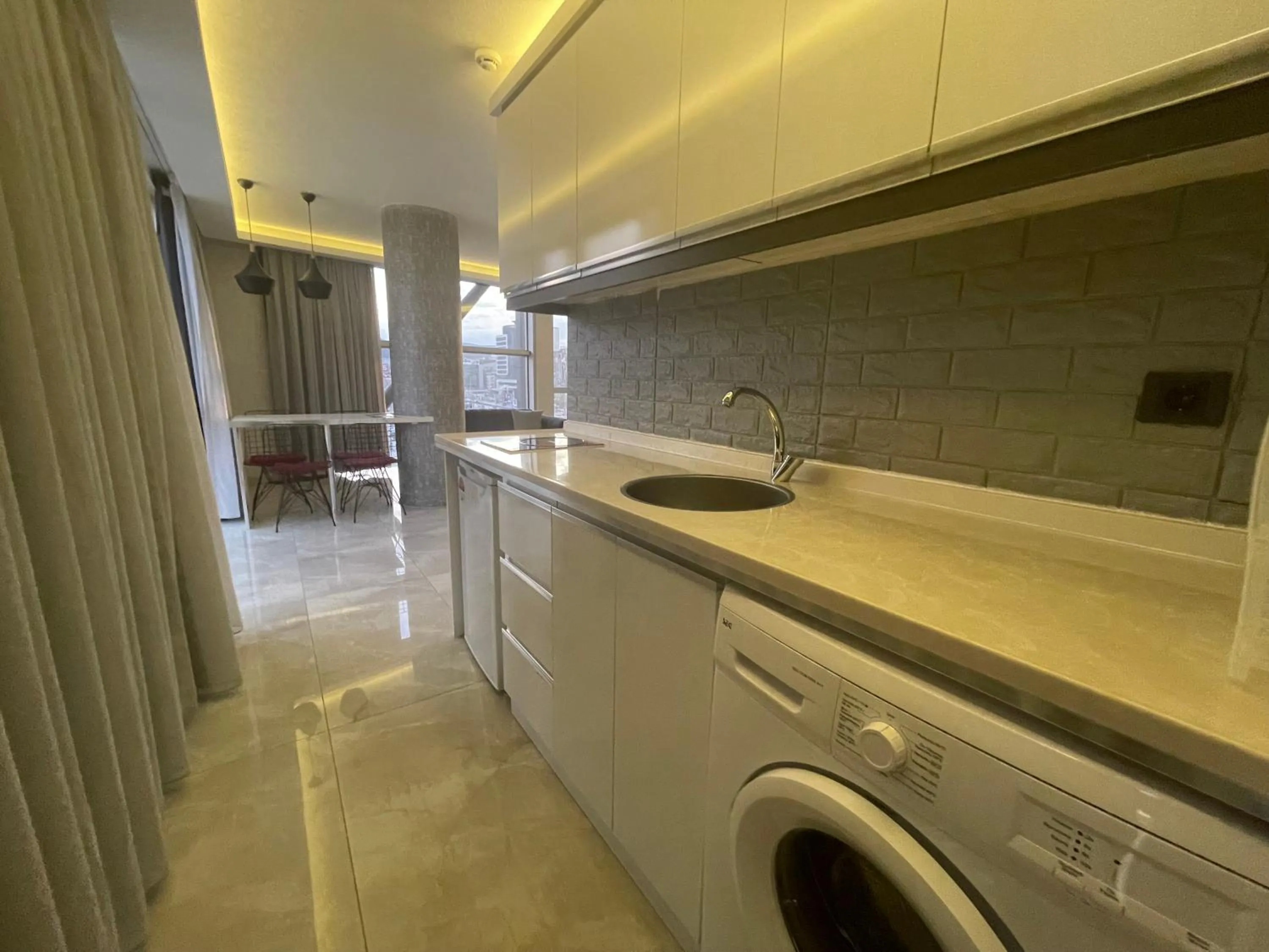 Kitchen or kitchenette in Le Luxe Suites Hotel