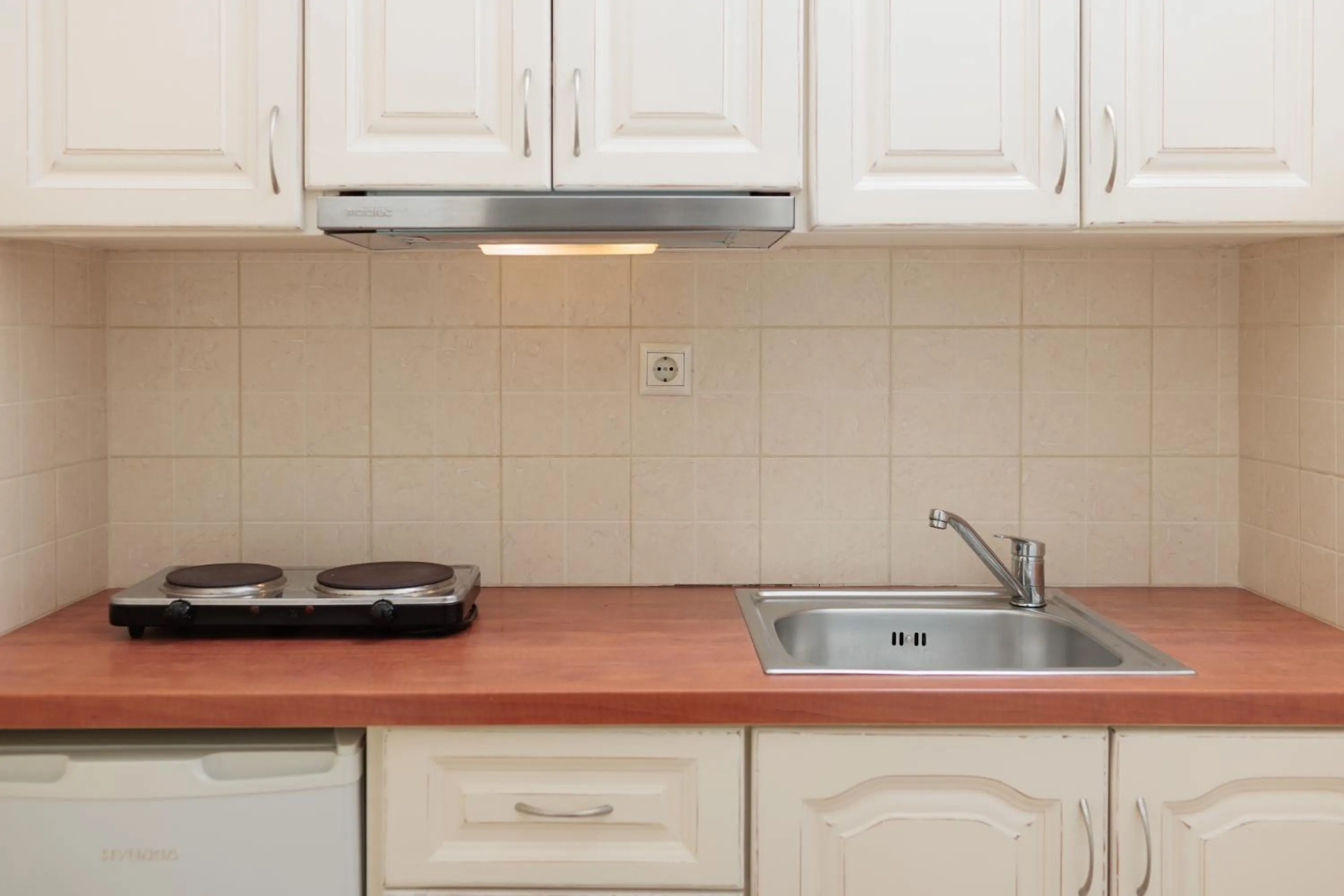 Kitchen or kitchenette in Maria's Rooms & Studios