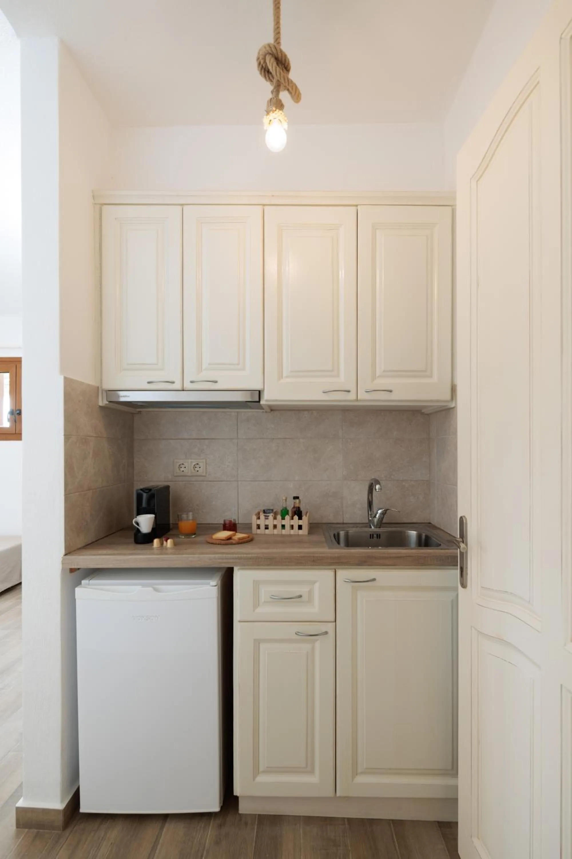 Kitchen or kitchenette in Maria's Rooms & Studios