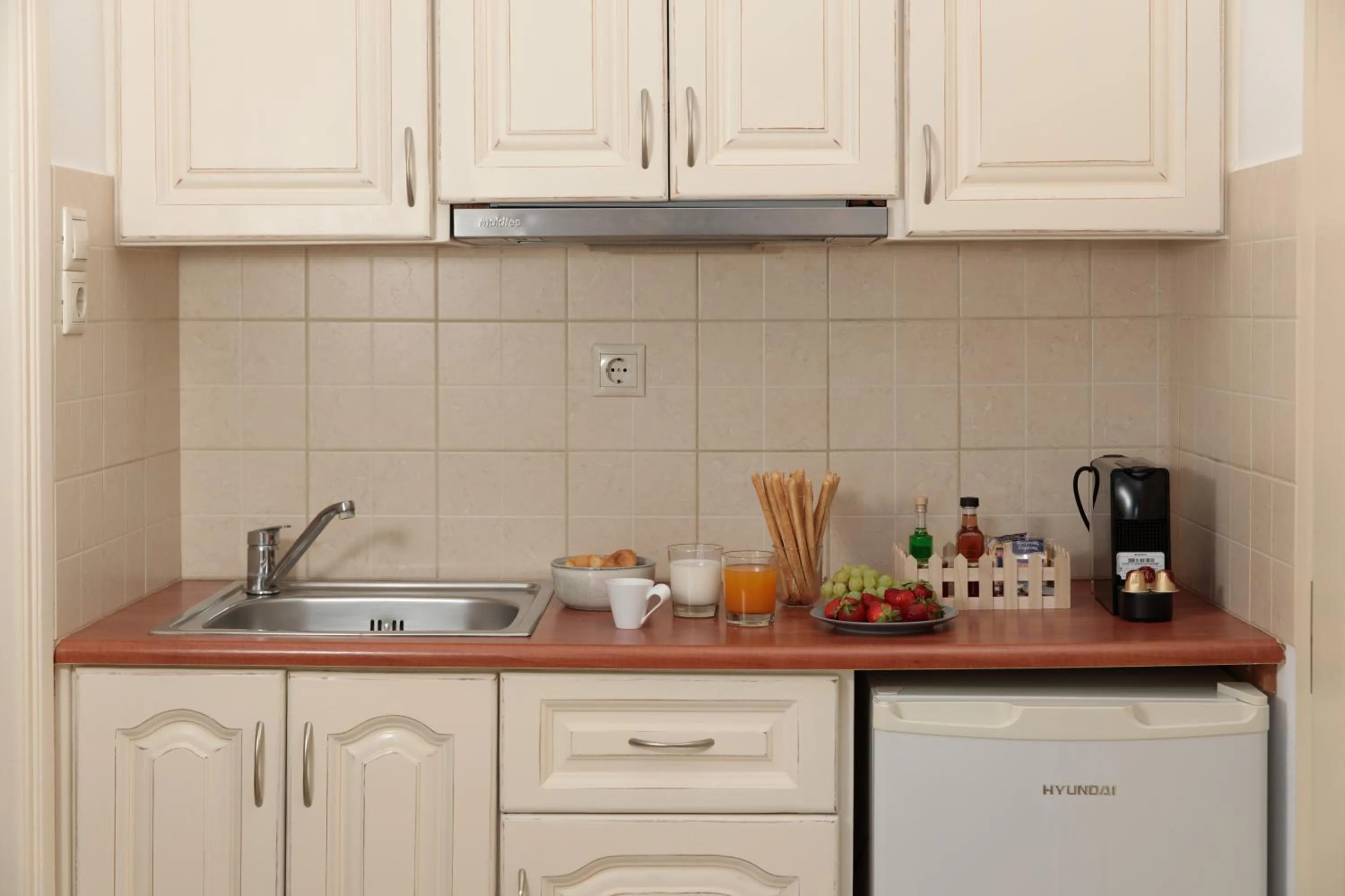 Kitchen or kitchenette in Maria's Rooms & Studios