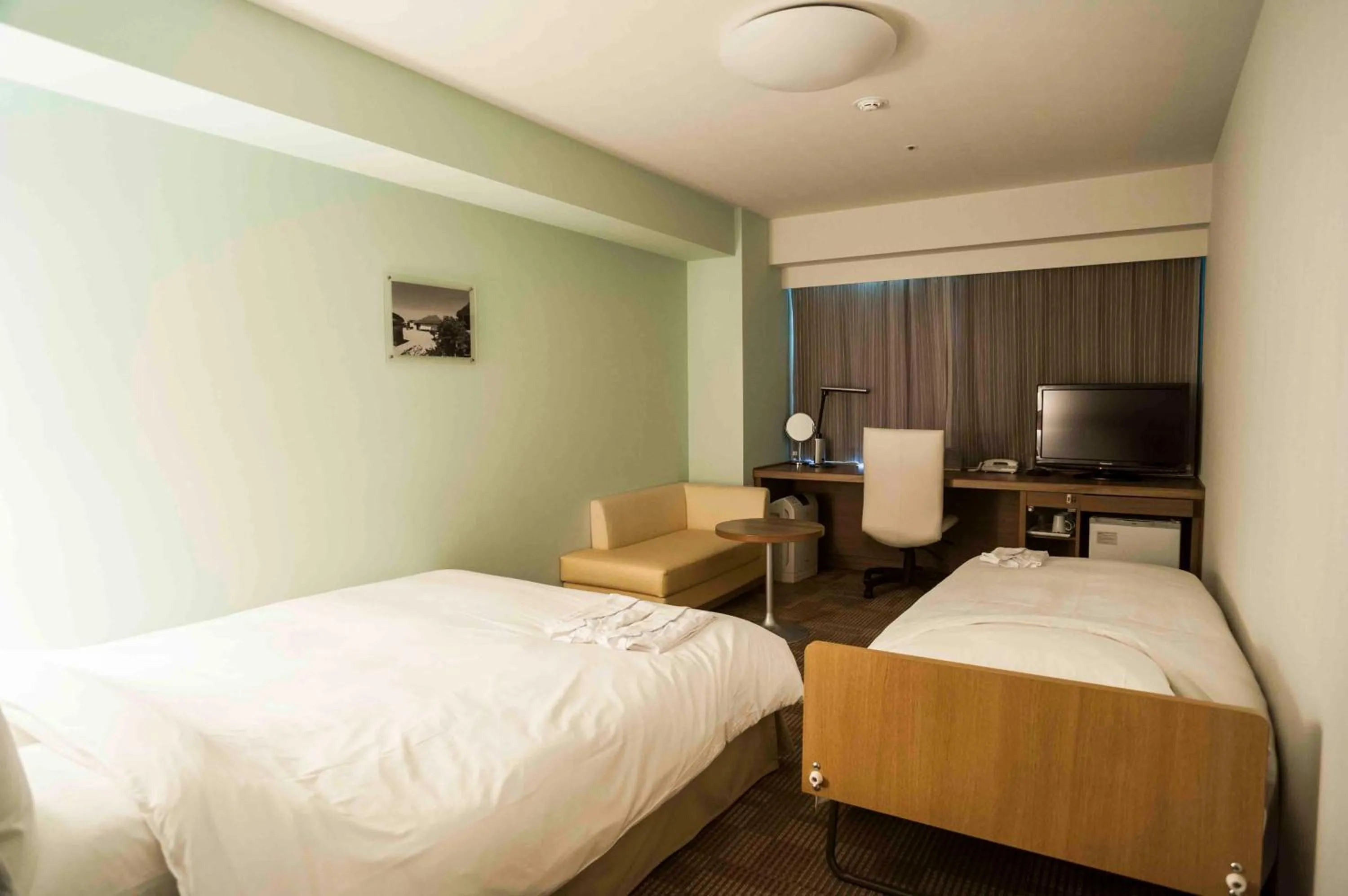 Bed in Daiwa Roynet Hotel Okinawa-Kenchomae