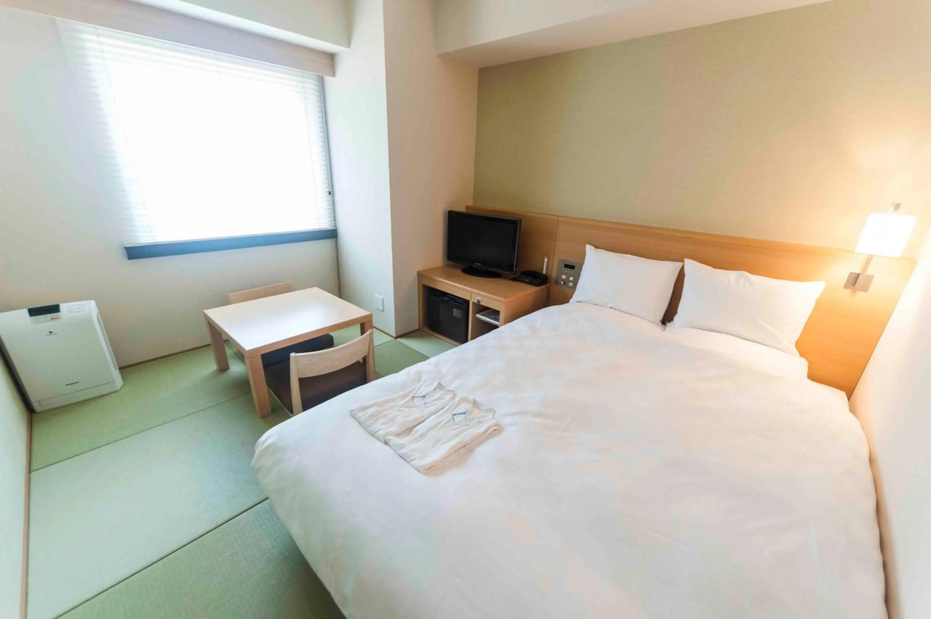 Photo of the whole room, Bed in Daiwa Roynet Hotel Okinawa-Kenchomae