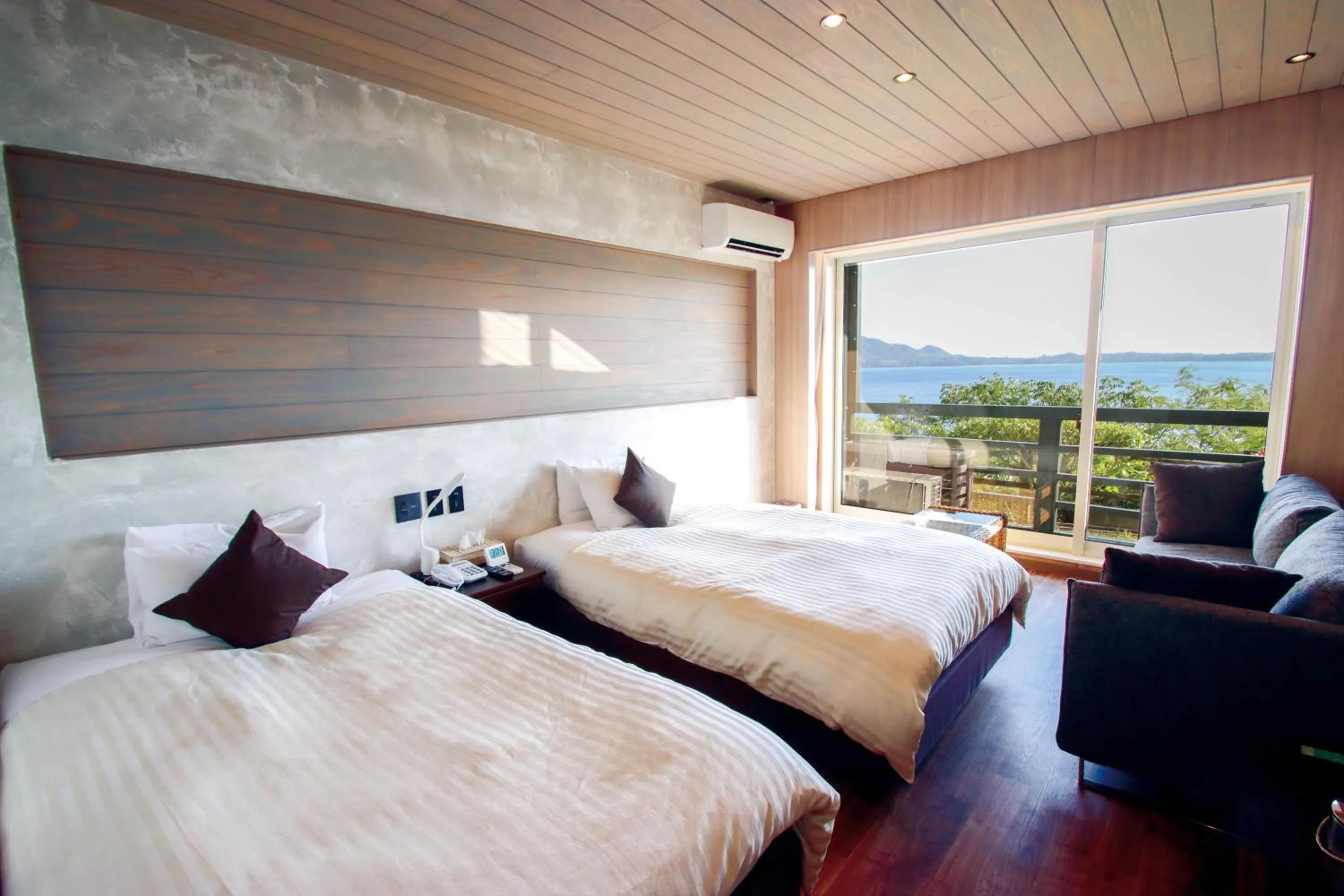 Bed in Petit Resort Native Sea Amami