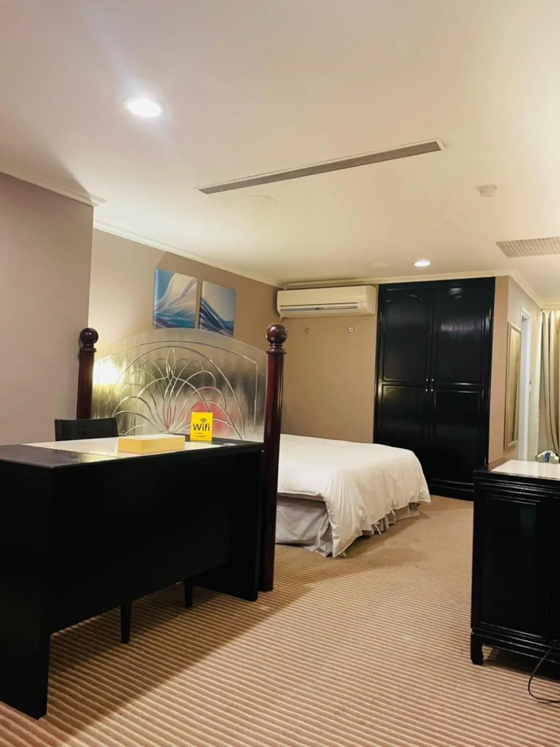 Bed in Felicity Business Hotel