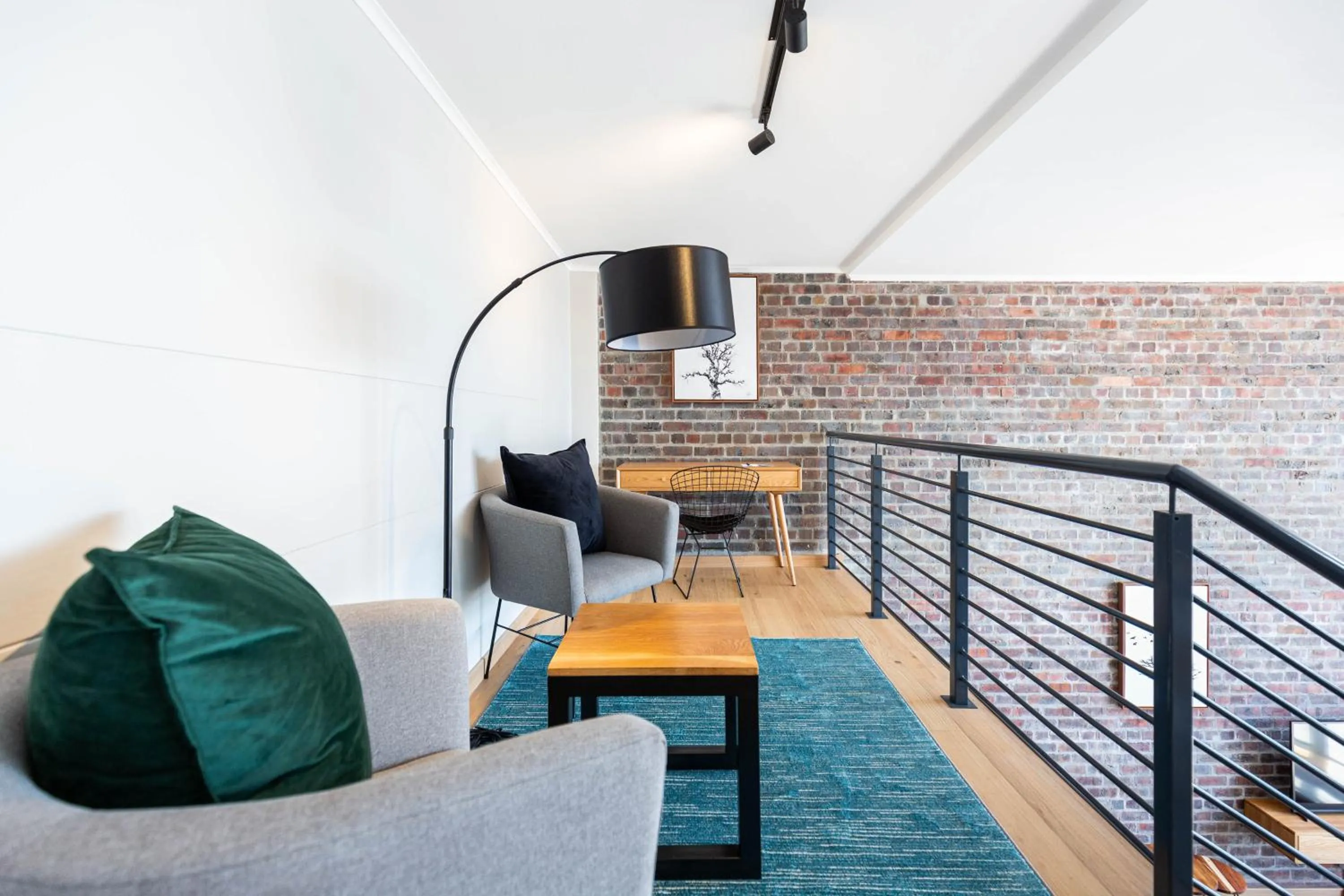 Seating area in Urban Artisan Luxury Suites by Totalstay