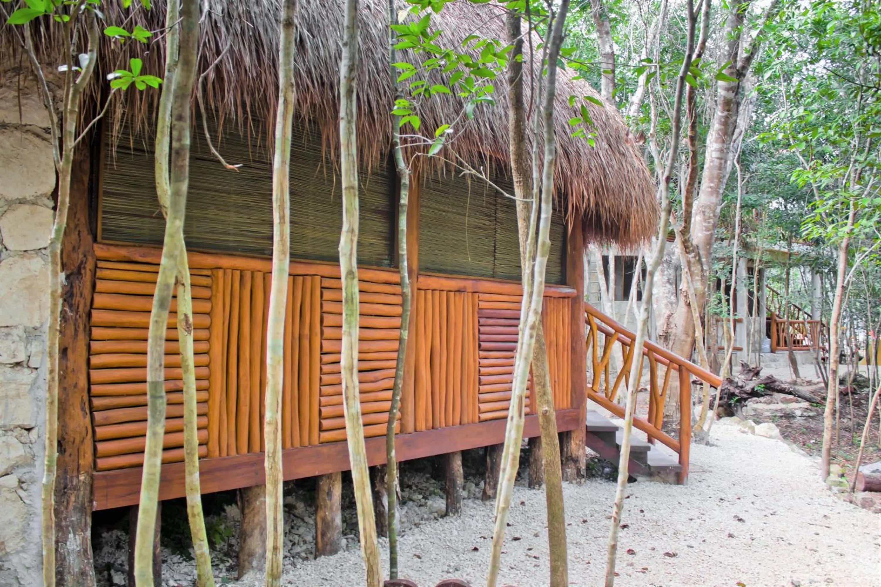 Photo of the whole room in Aldea Maya-Ha Cabañas con cenotes