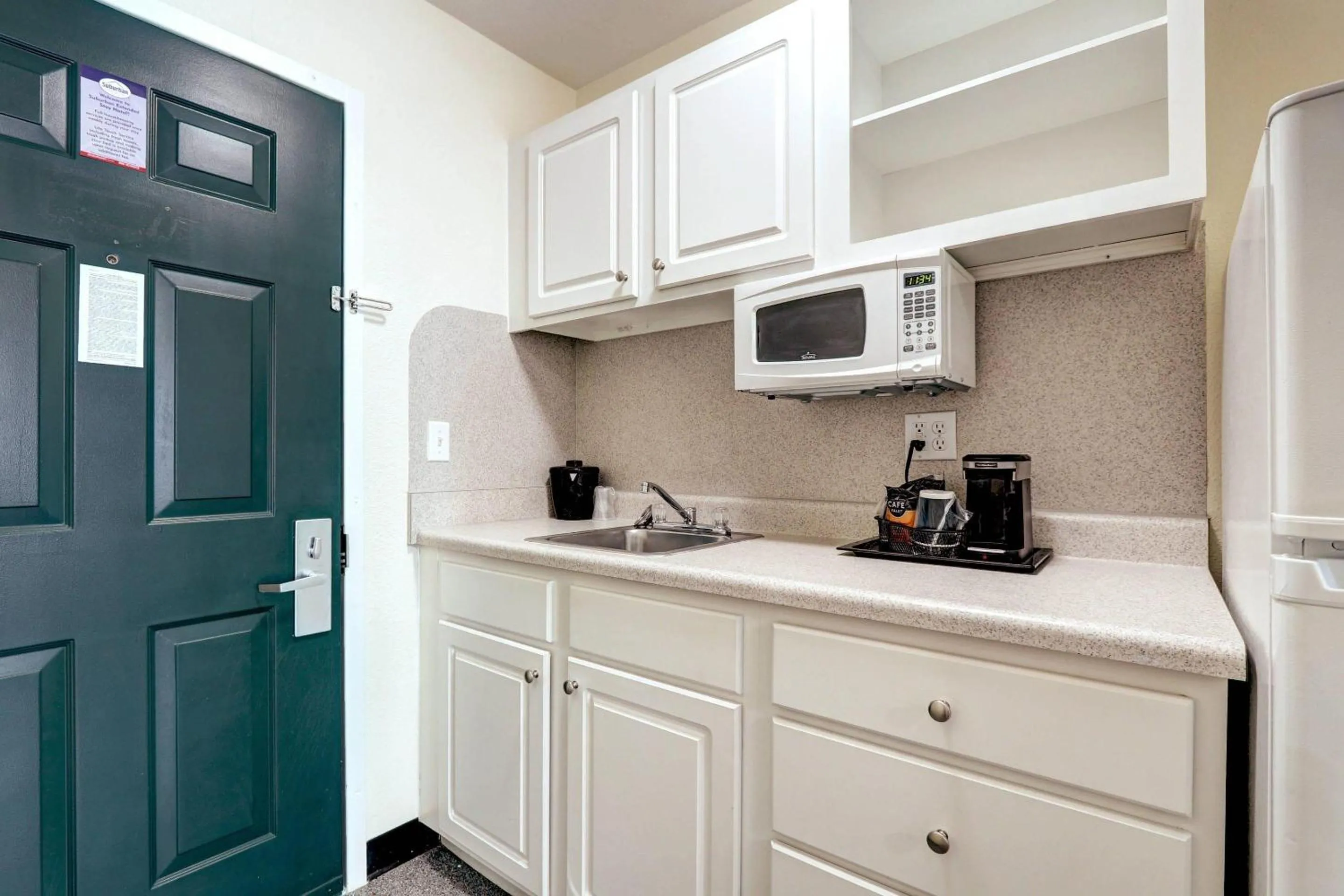 Bedroom in Suburban Studios Westminster Denver North