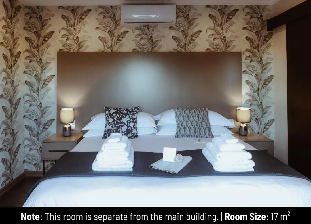 Bed in The Feather Hill Boutique Hotel