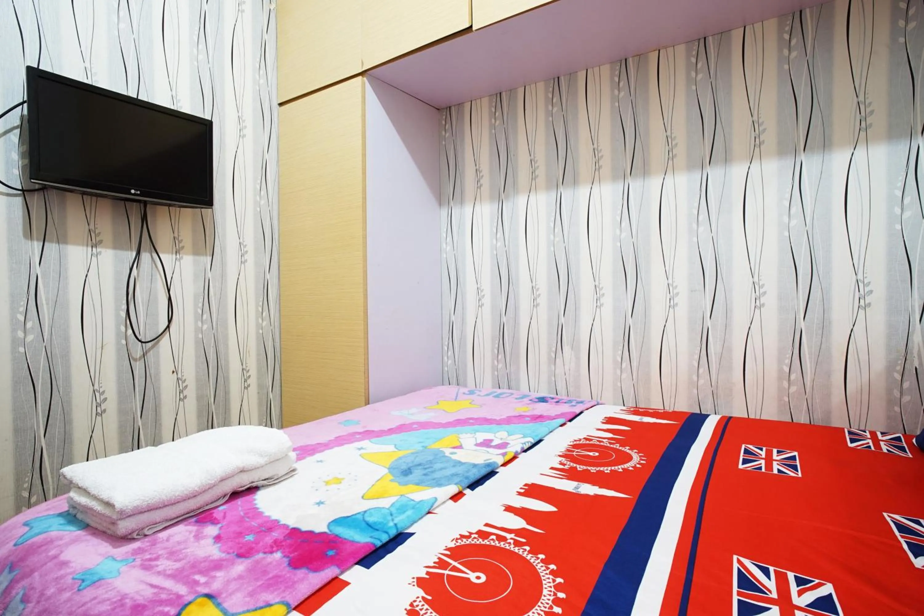 Bed in Kamarku Apartment at The Edge