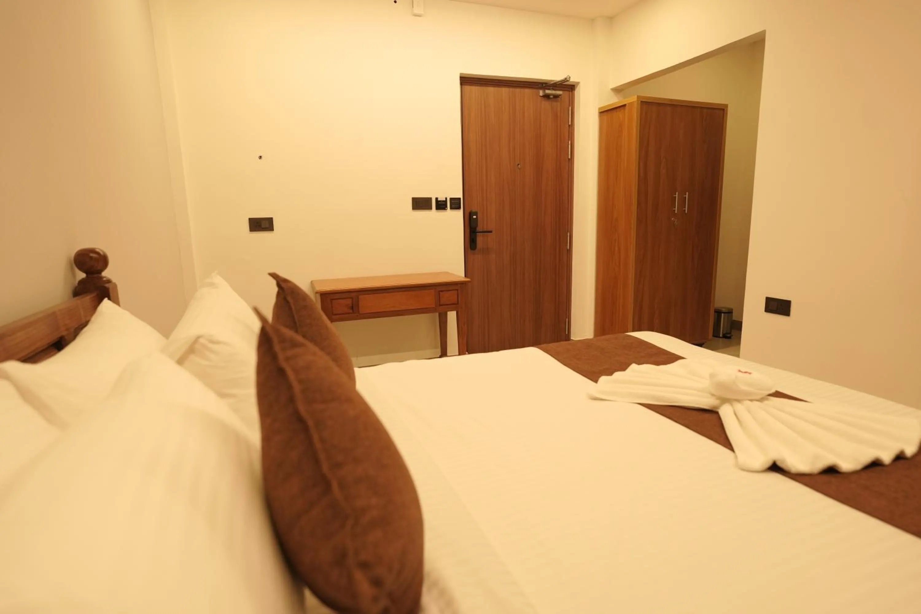 Bed in Aadisaktthi Leisure Resort, Kovalam