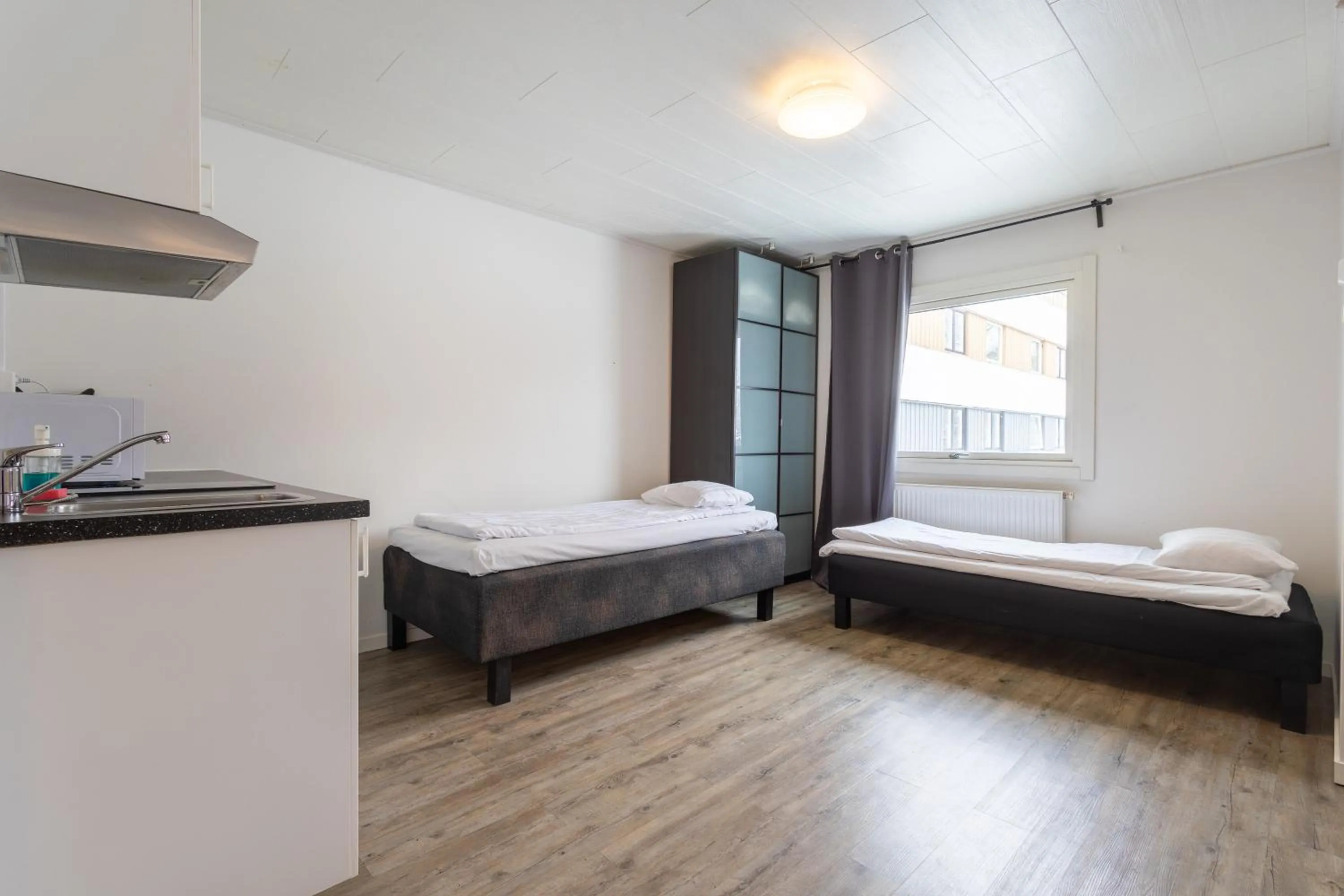 Kitchen or kitchenette, Bed in Halmstad Hotel Apartments