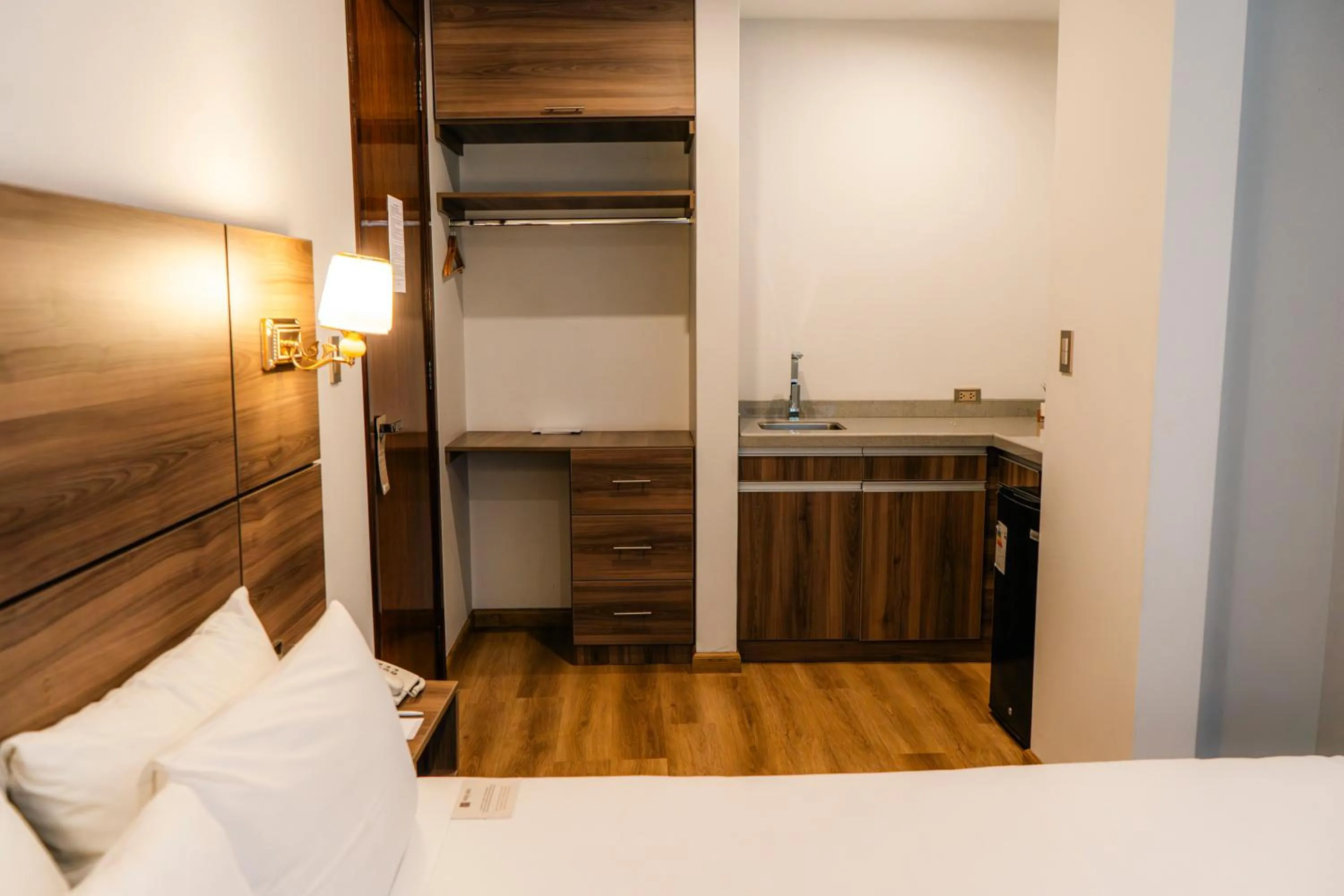 Kitchen or kitchenette, Bed in HOTEL PIEDRA SANTA - Moquegua