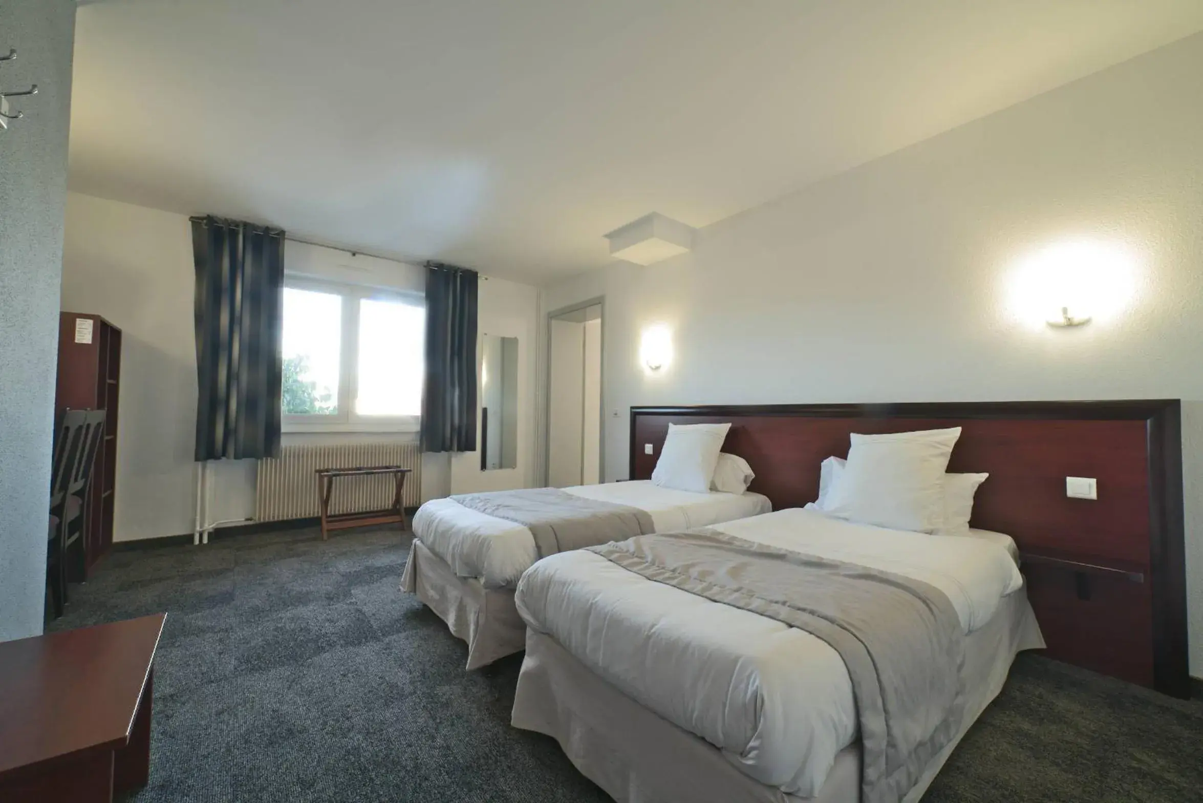 Queen Room with Two Queen Beds - single occupancy - Disability Access in Logis Hôtel & Restaurant Au Lion d'Or Queen Room with Two Queen Beds - single occupancy - Disability Access in Logis Hôtel & Restaurant Au Lion d'Or