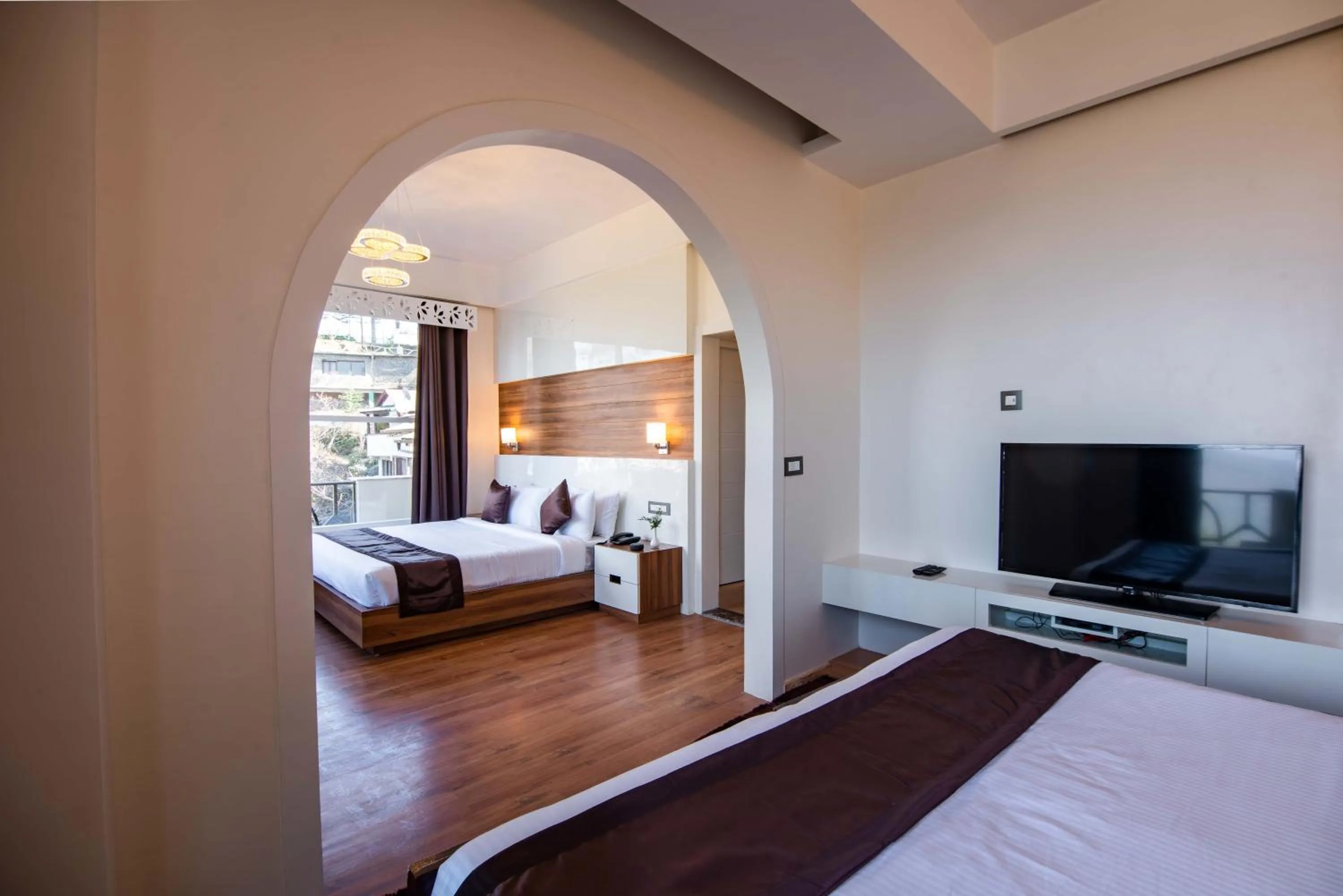 Bed in Clarks Exotica Resort Ramgarh Mukteshwar