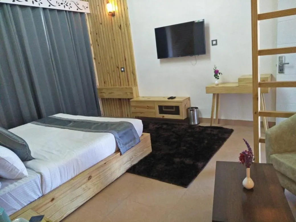 Bed in Clarks Exotica Resort Ramgarh Mukteshwar