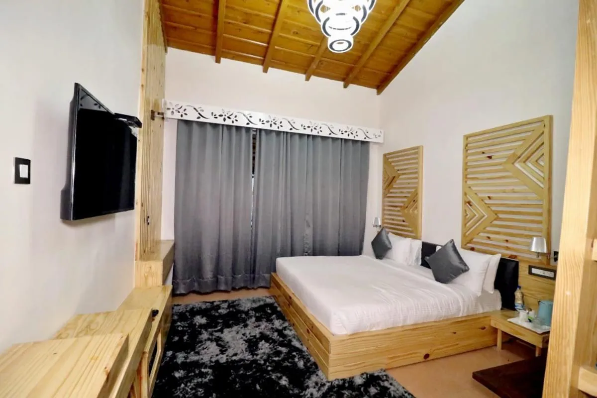 Bed in Clarks Exotica Resort Ramgarh Mukteshwar