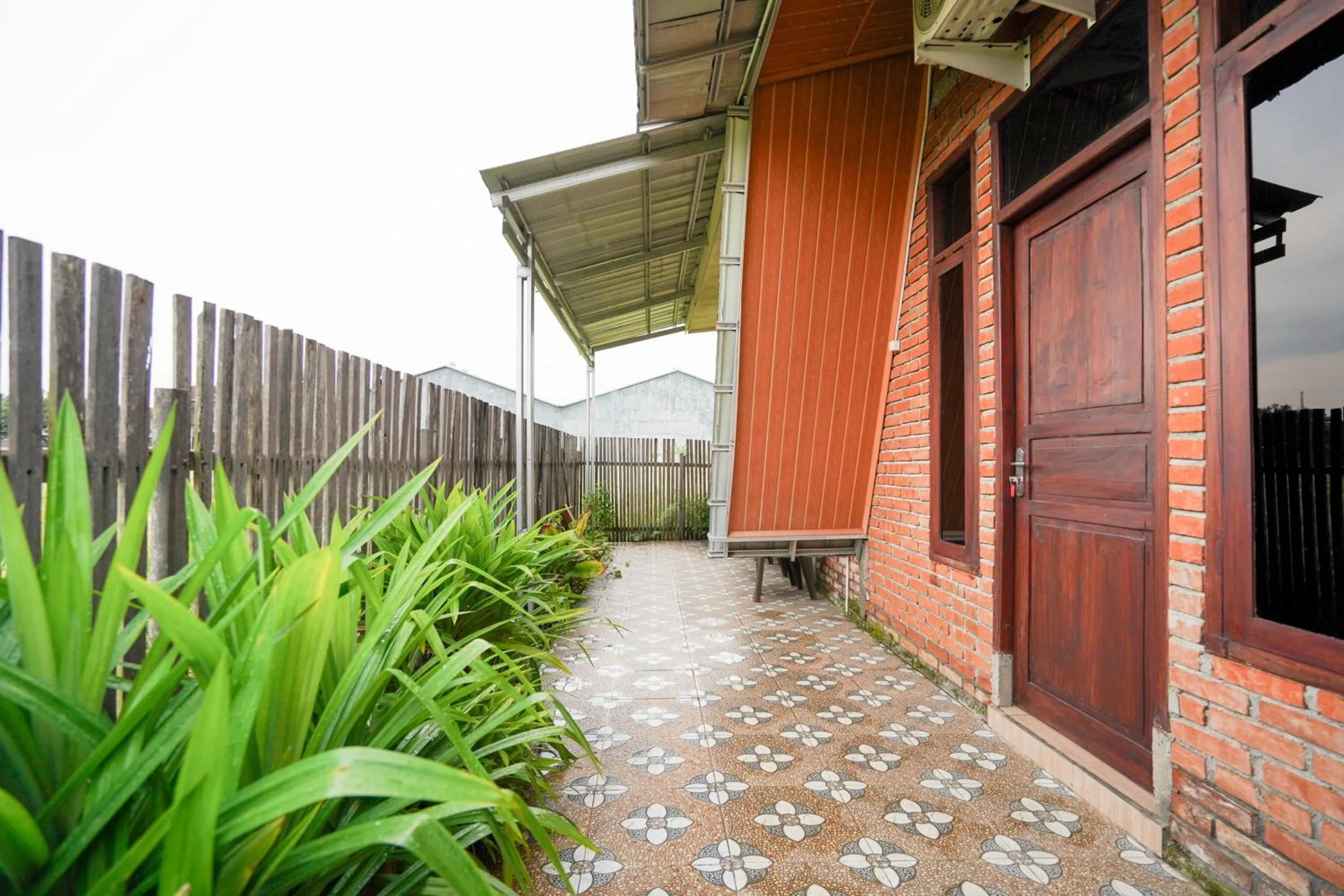 Property building in RedDoorz at Omah Kayu Homestay Yogyakarta