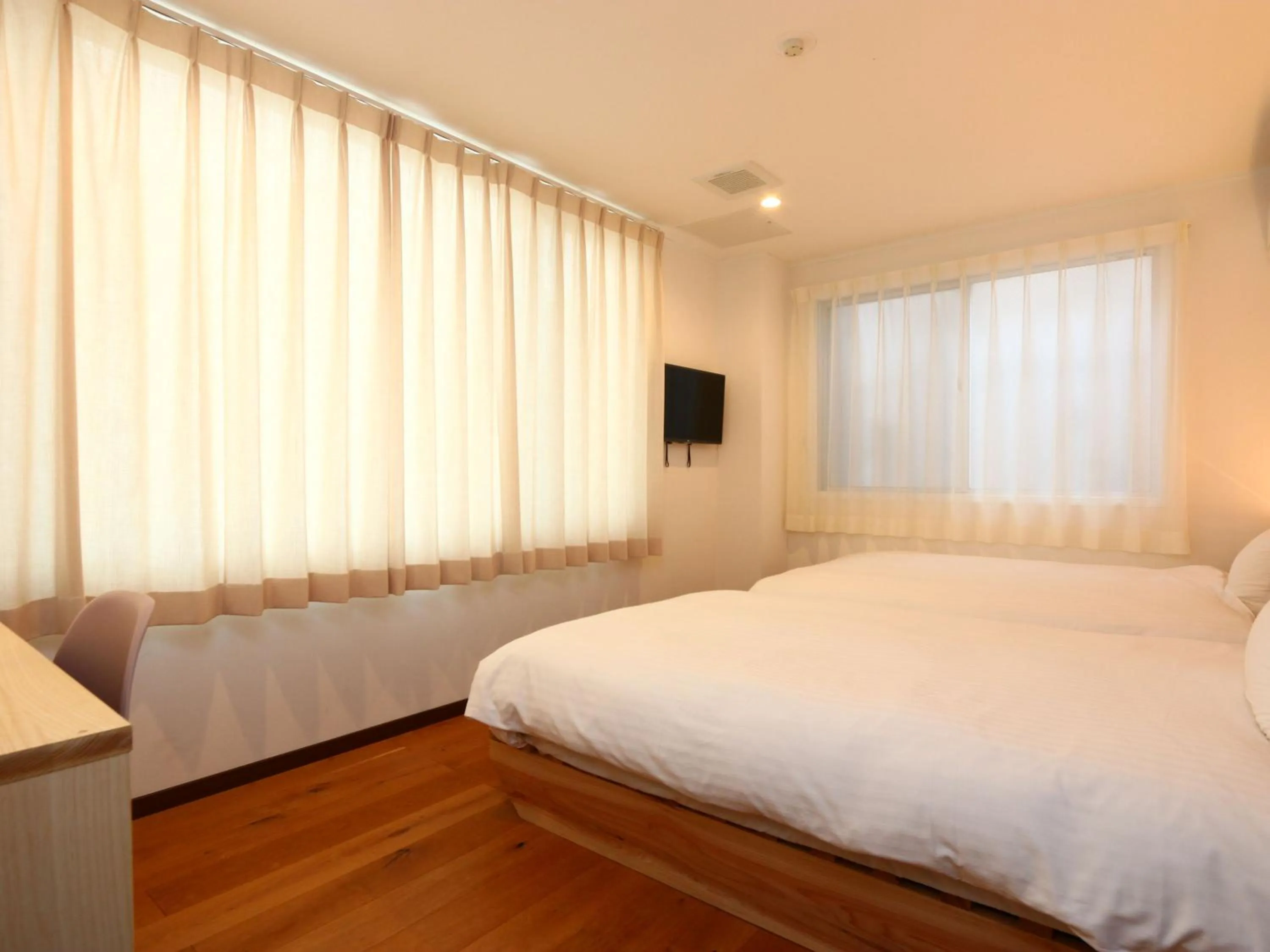 Bed in nirasakiyaSTAY