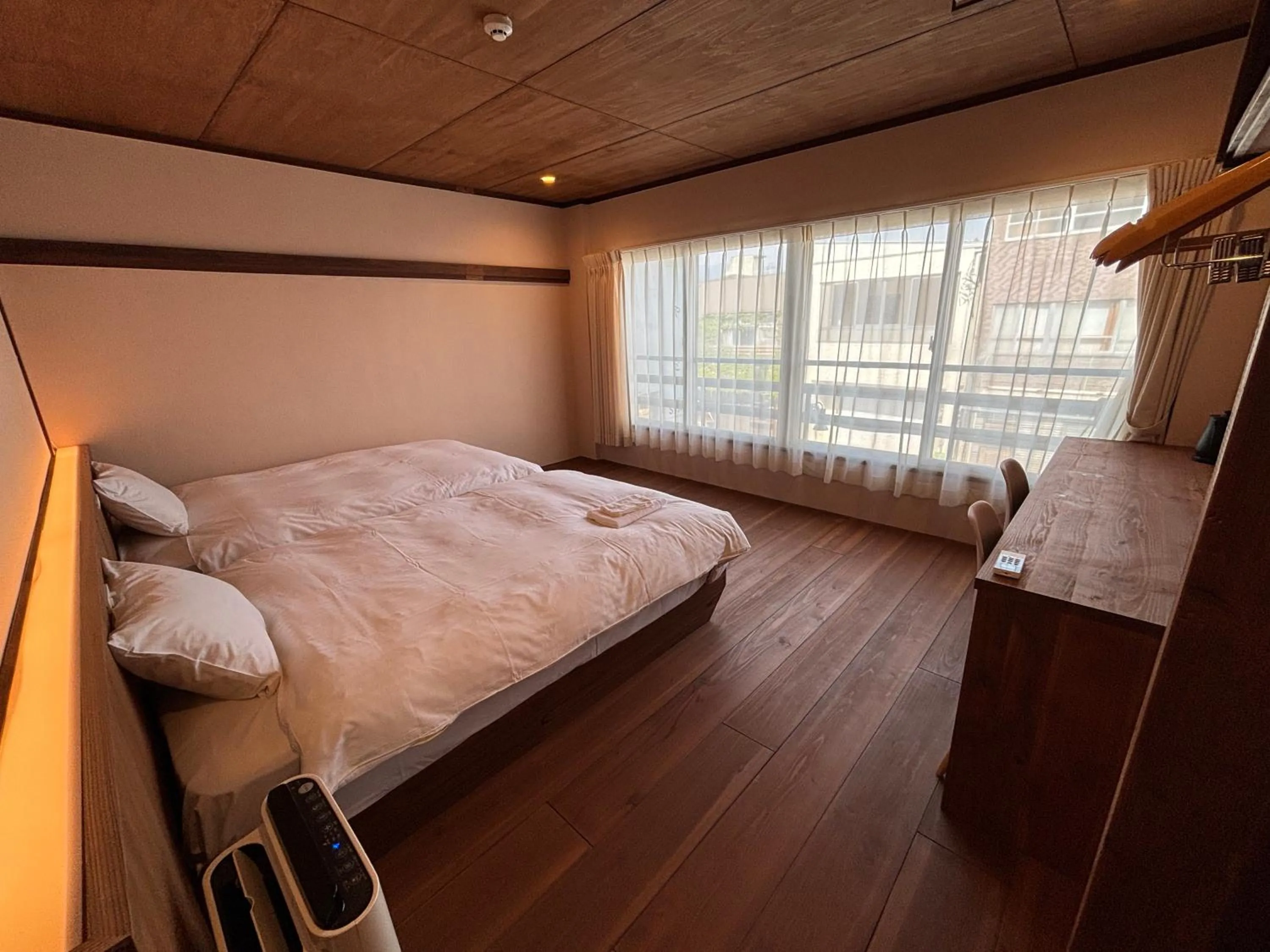 Bed in nirasakiyaSTAY