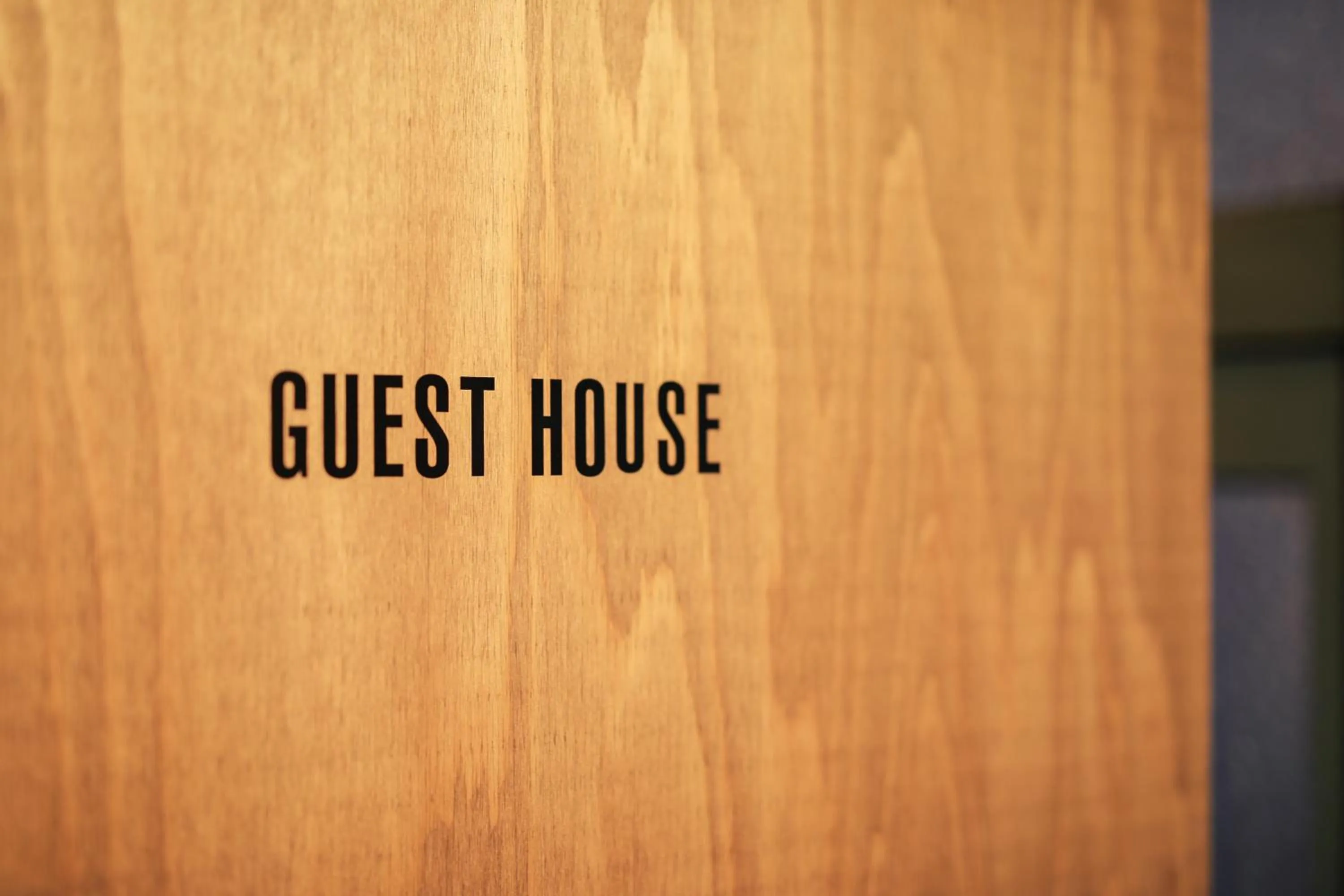 Property logo or sign in chAho Hostel Nirasaki / Outdoor Base