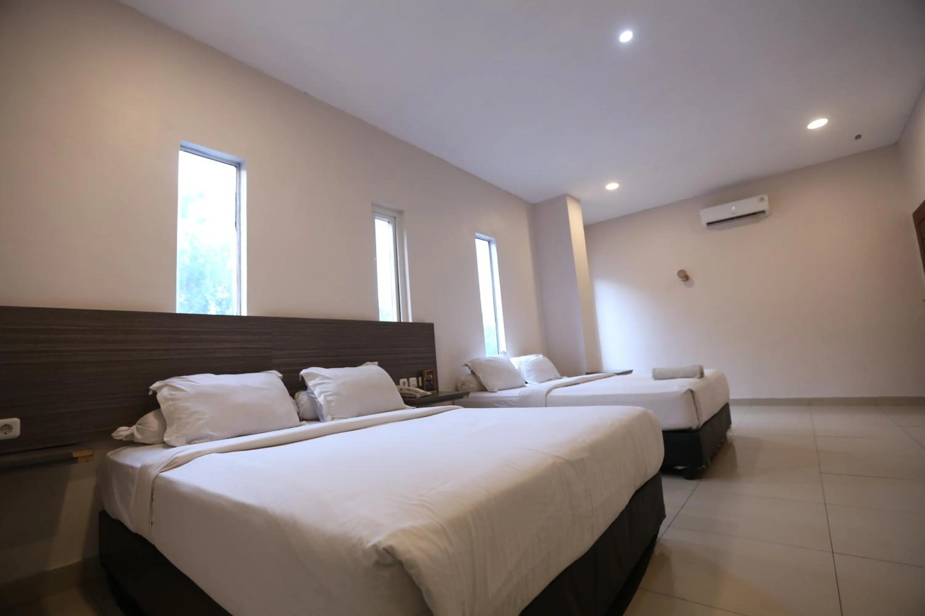 Bed in De'Tonga Hotel