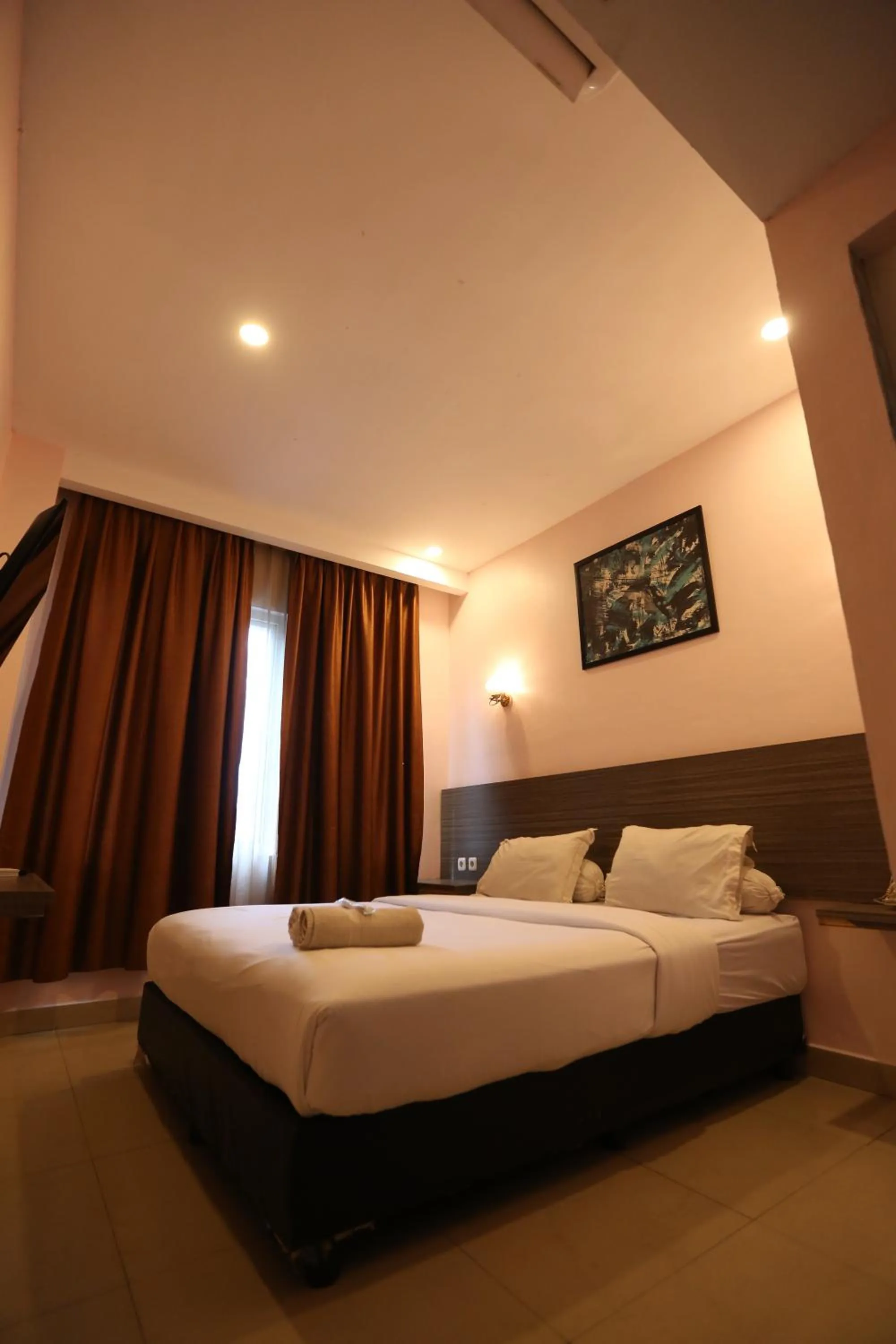 Bed in De'Tonga Hotel