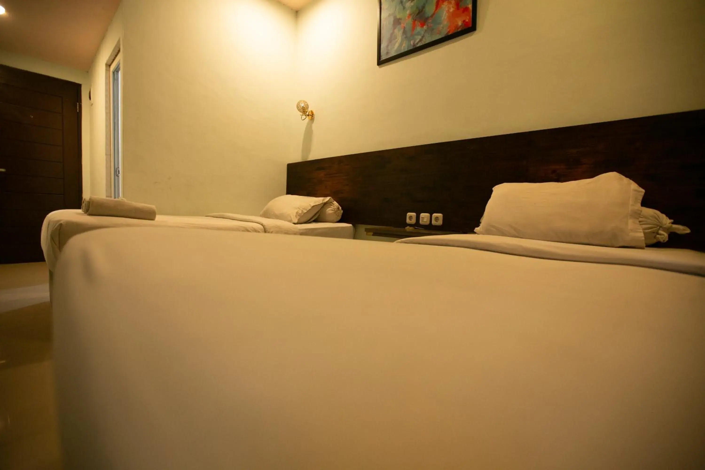 Bed in De'Tonga Hotel Bed in De'Tonga Hotel