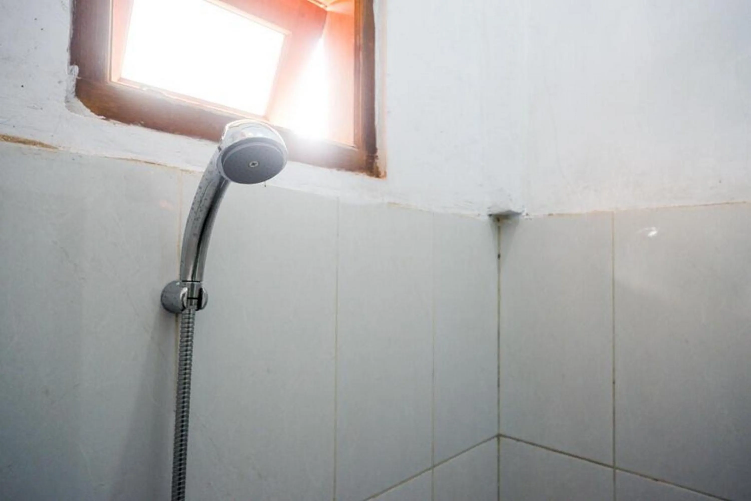 Bathroom in RedDoorz Syariah near Alun Alun Balai Kota Tegal