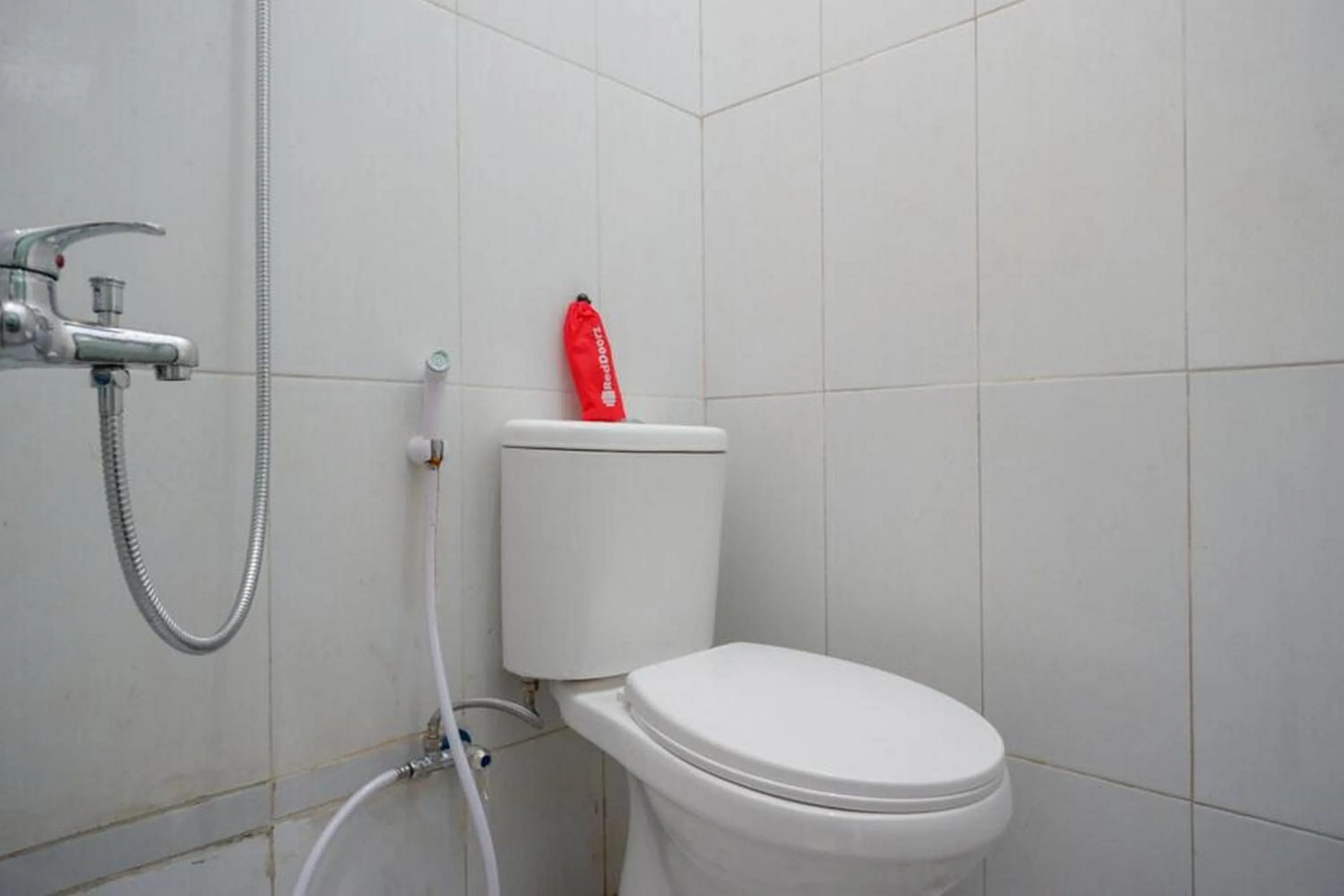 Bathroom in RedDoorz Syariah near Alun Alun Balai Kota Tegal