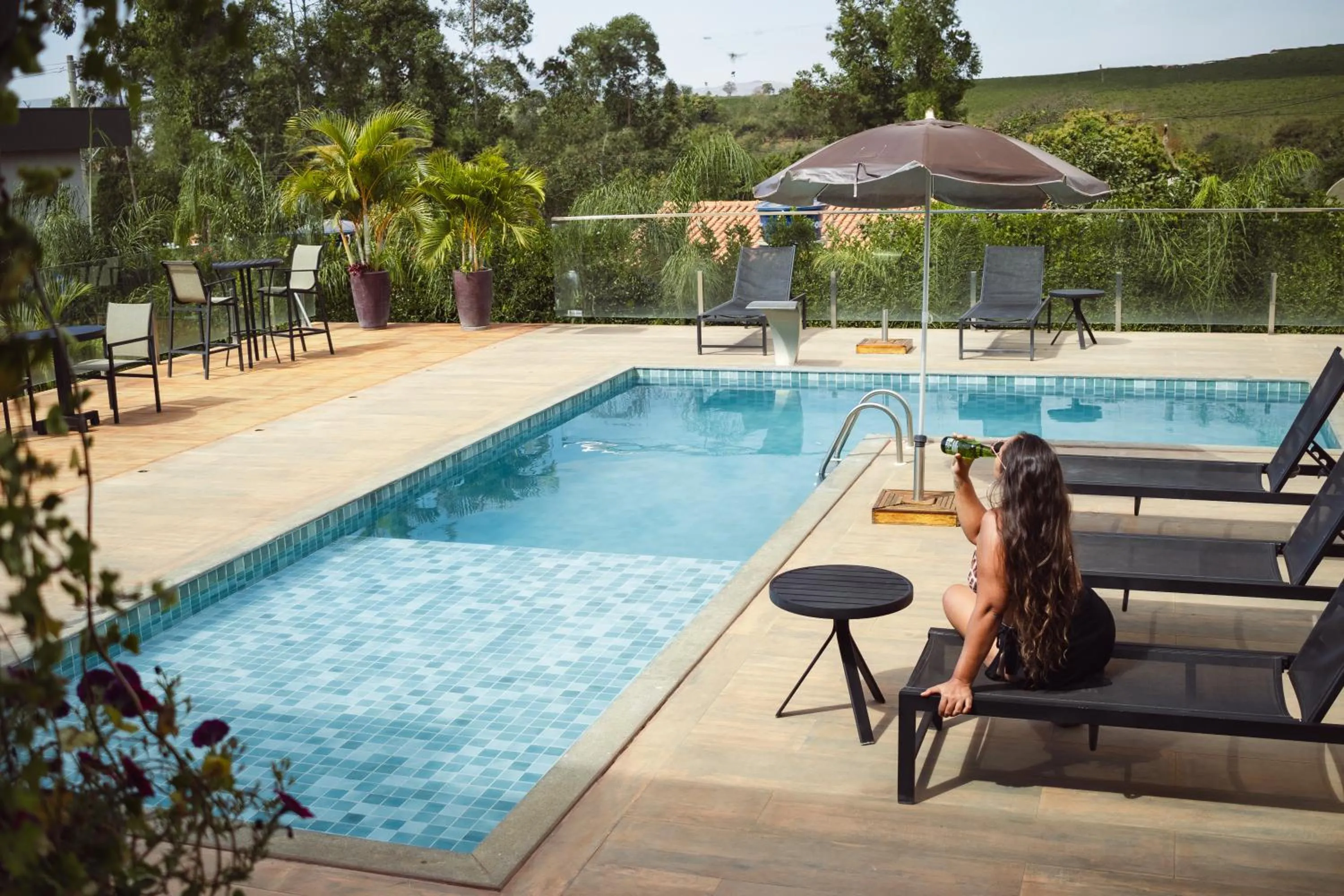 Swimming pool in Pousada Viver Capitólio