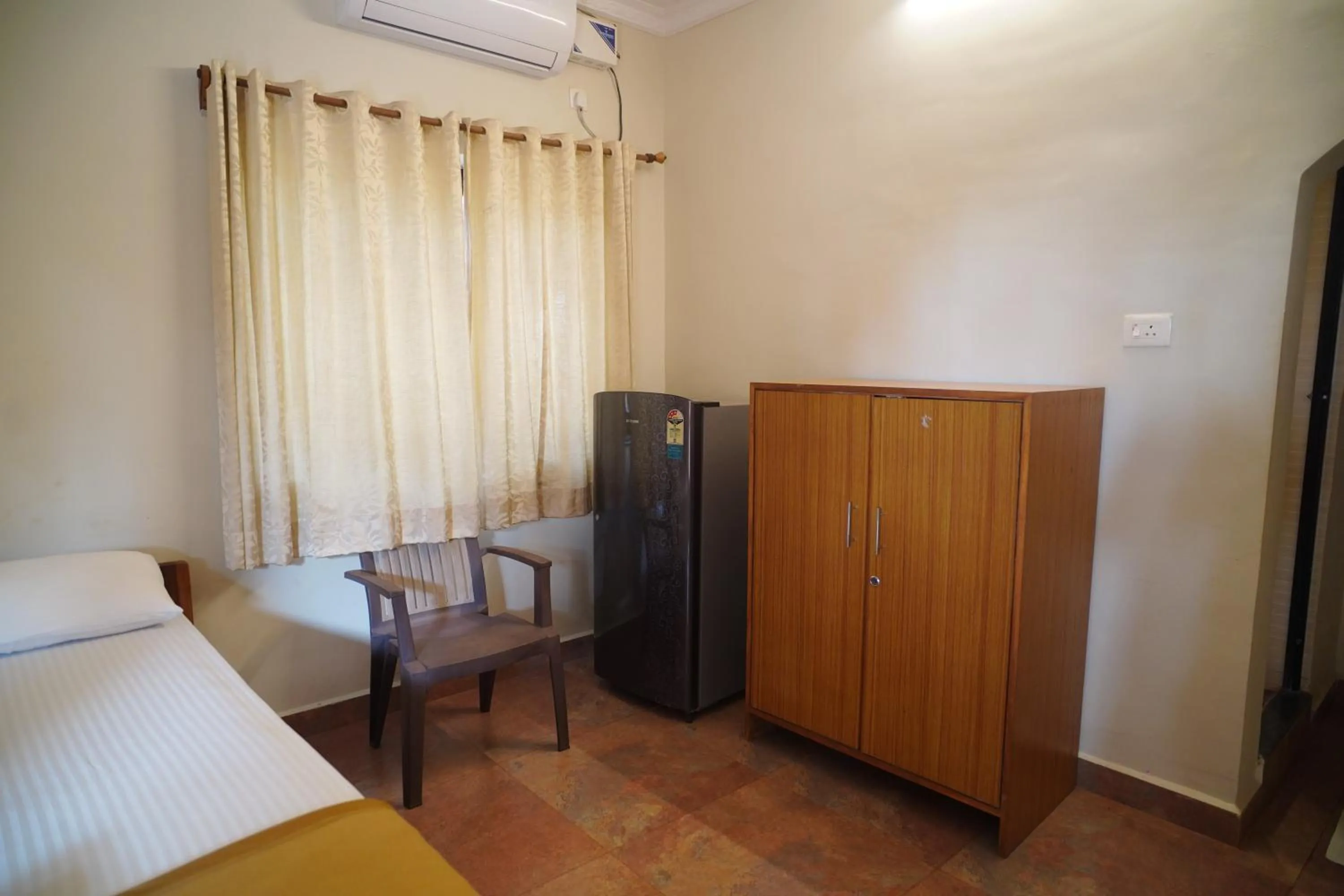 Photo of the whole room, Bed in God's Gift Guest House