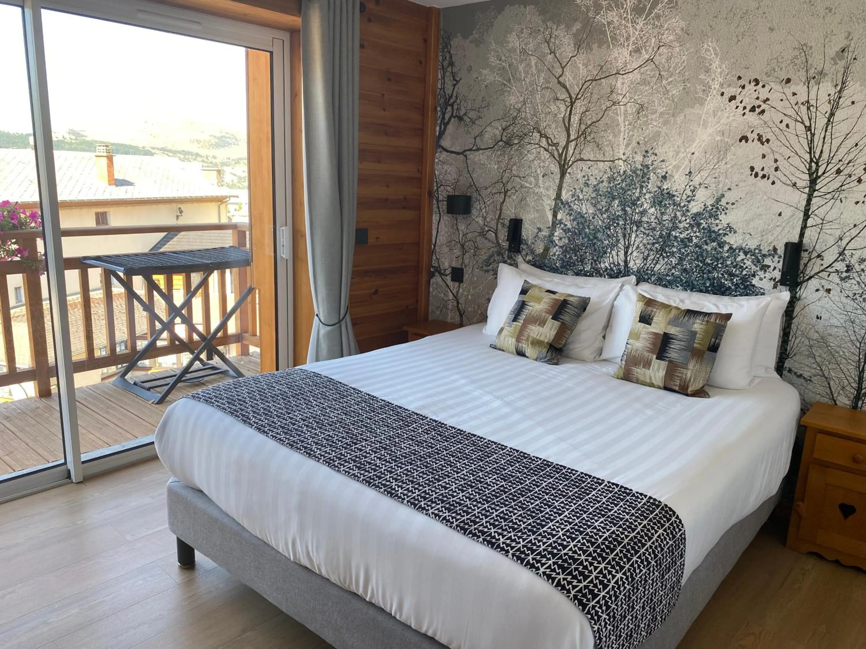 Balcony/Terrace, Bed in Logis Hôtel & Spa Les Autanes