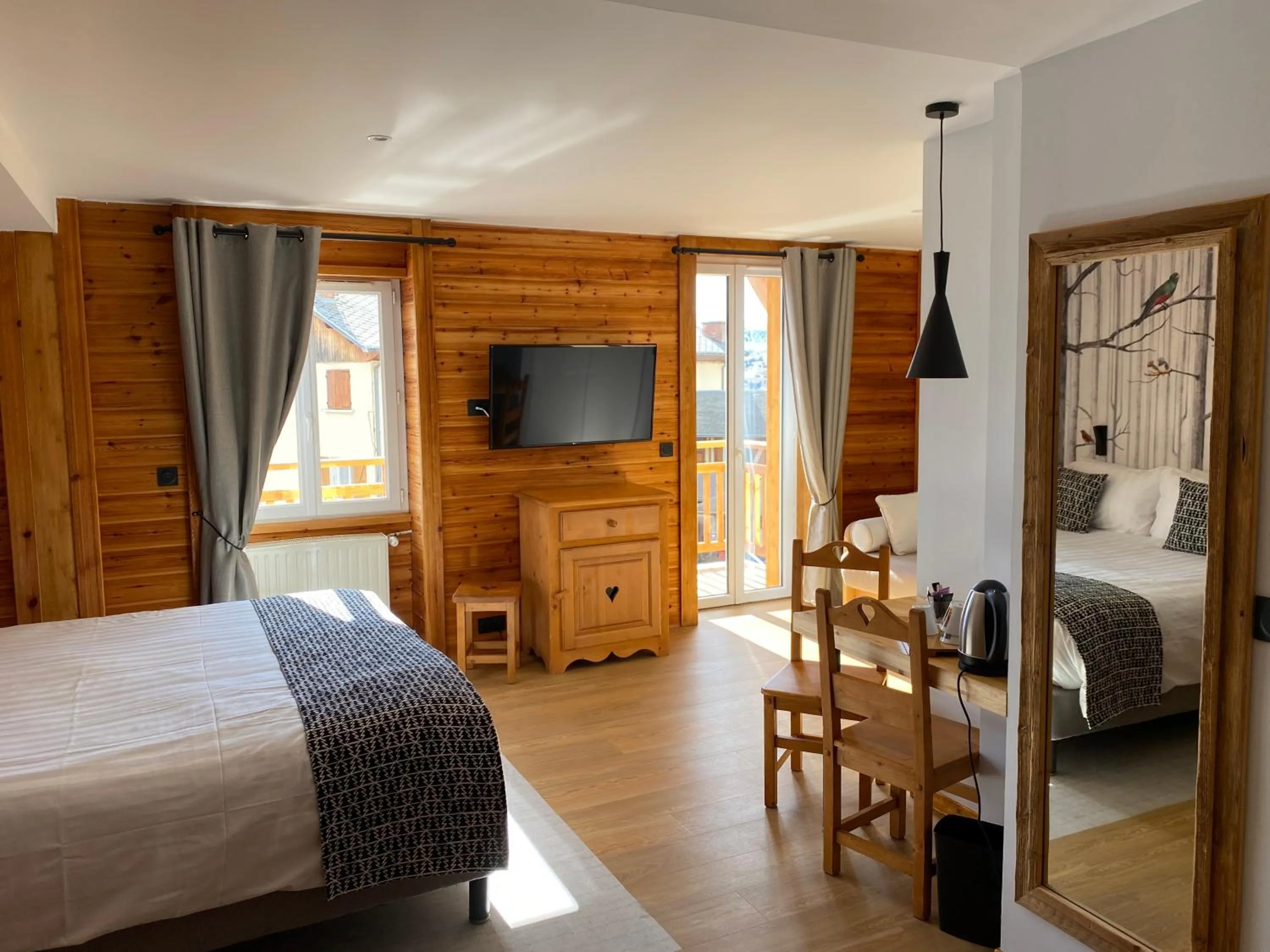Photo of the whole room, Bed in Logis Hôtel & Spa Les Autanes