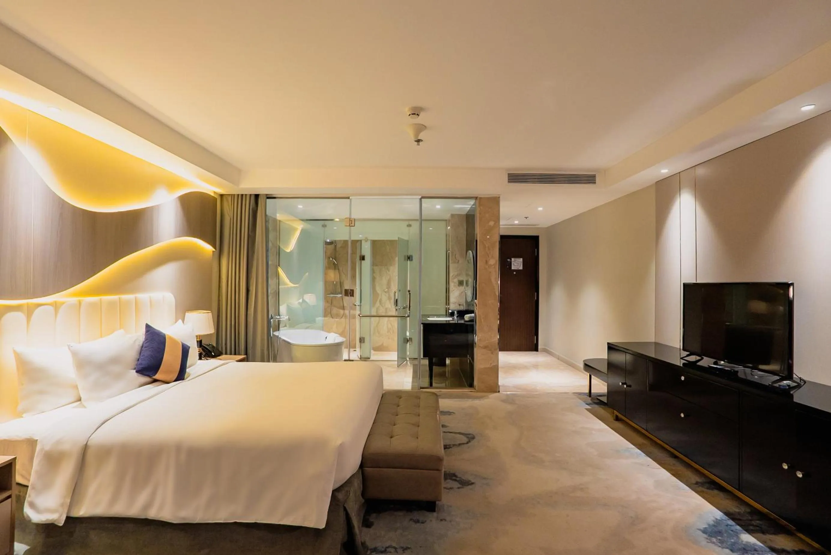 Bed in La Vela Saigon Hotel