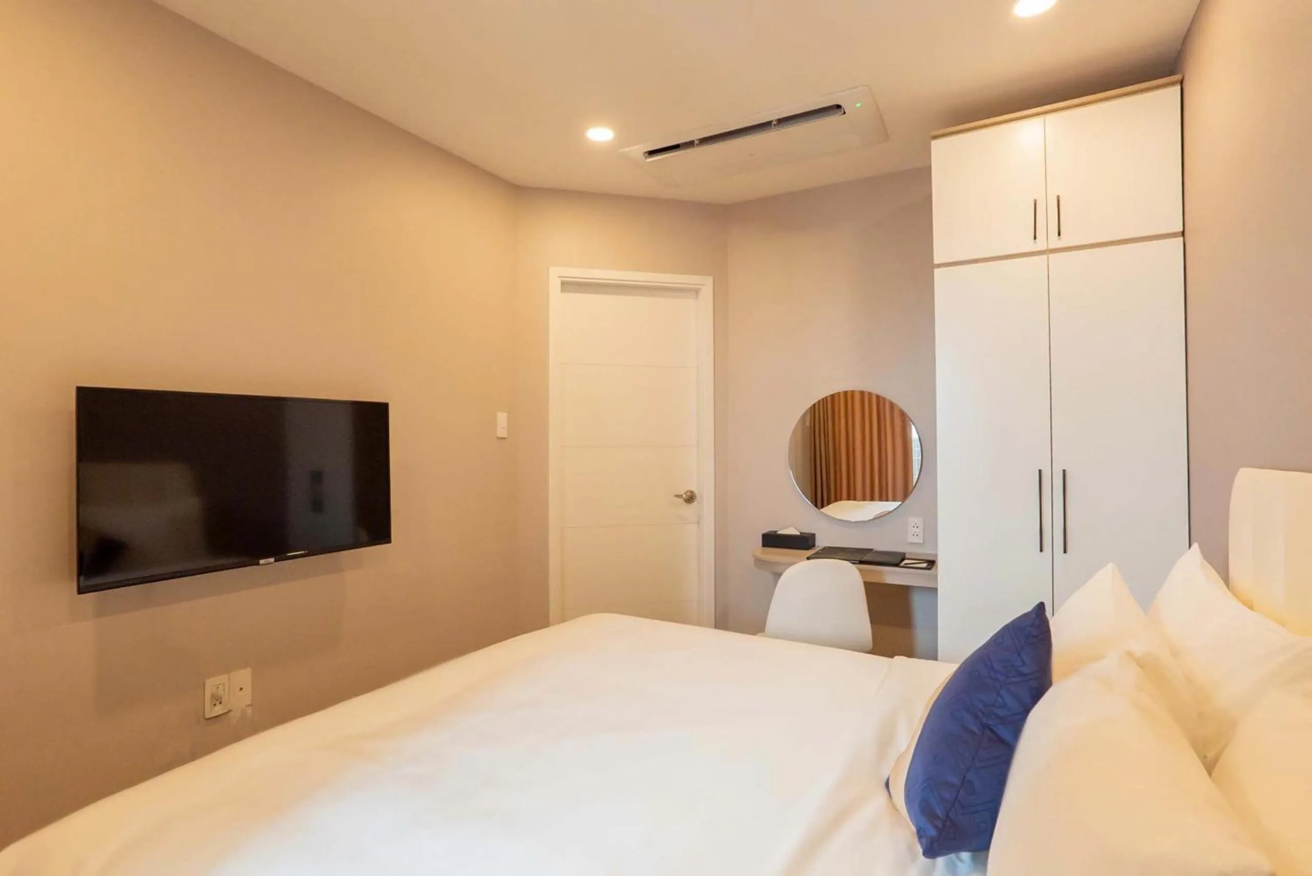 Bed in La Vela Saigon Hotel