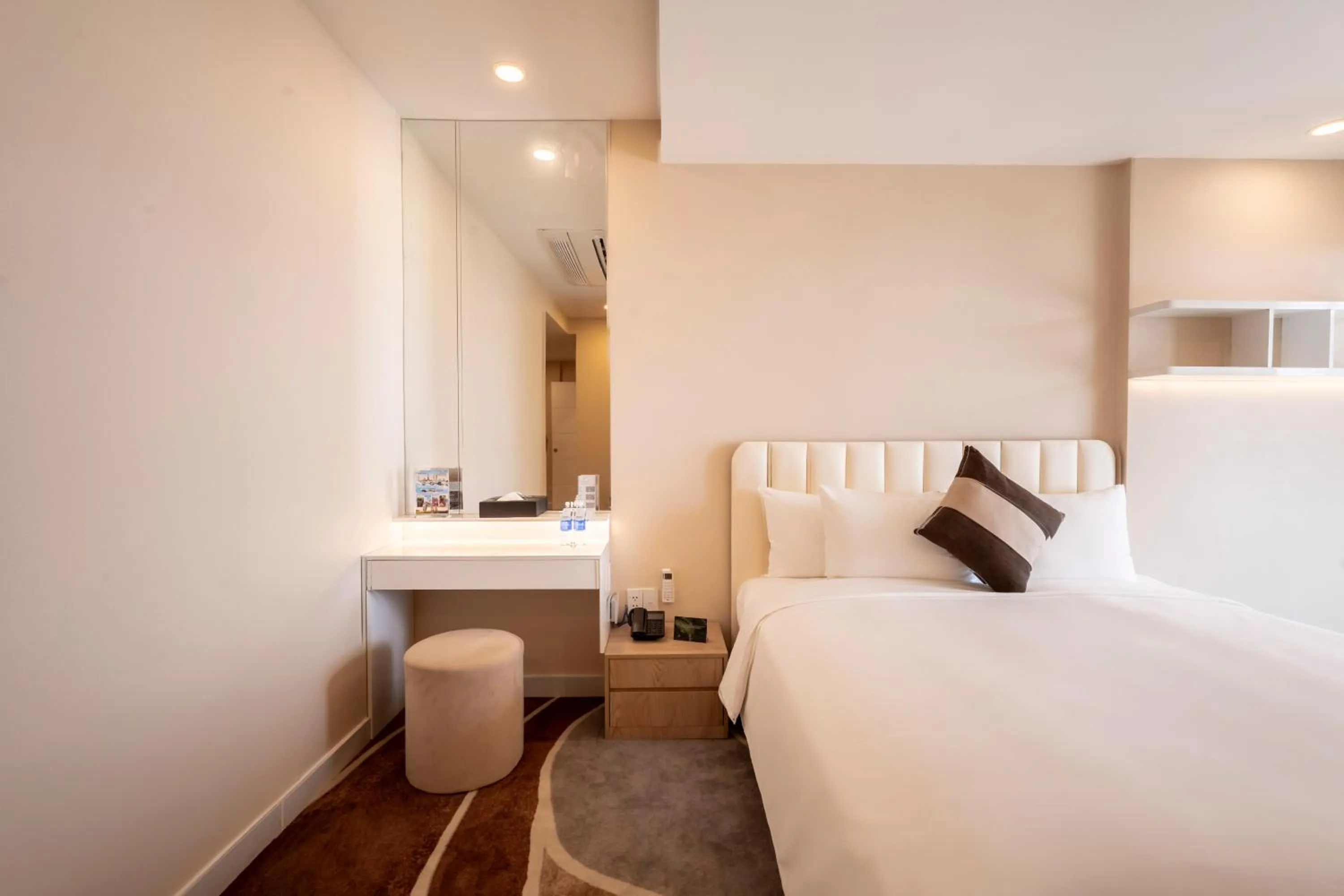 Bed in La Vela Saigon Hotel