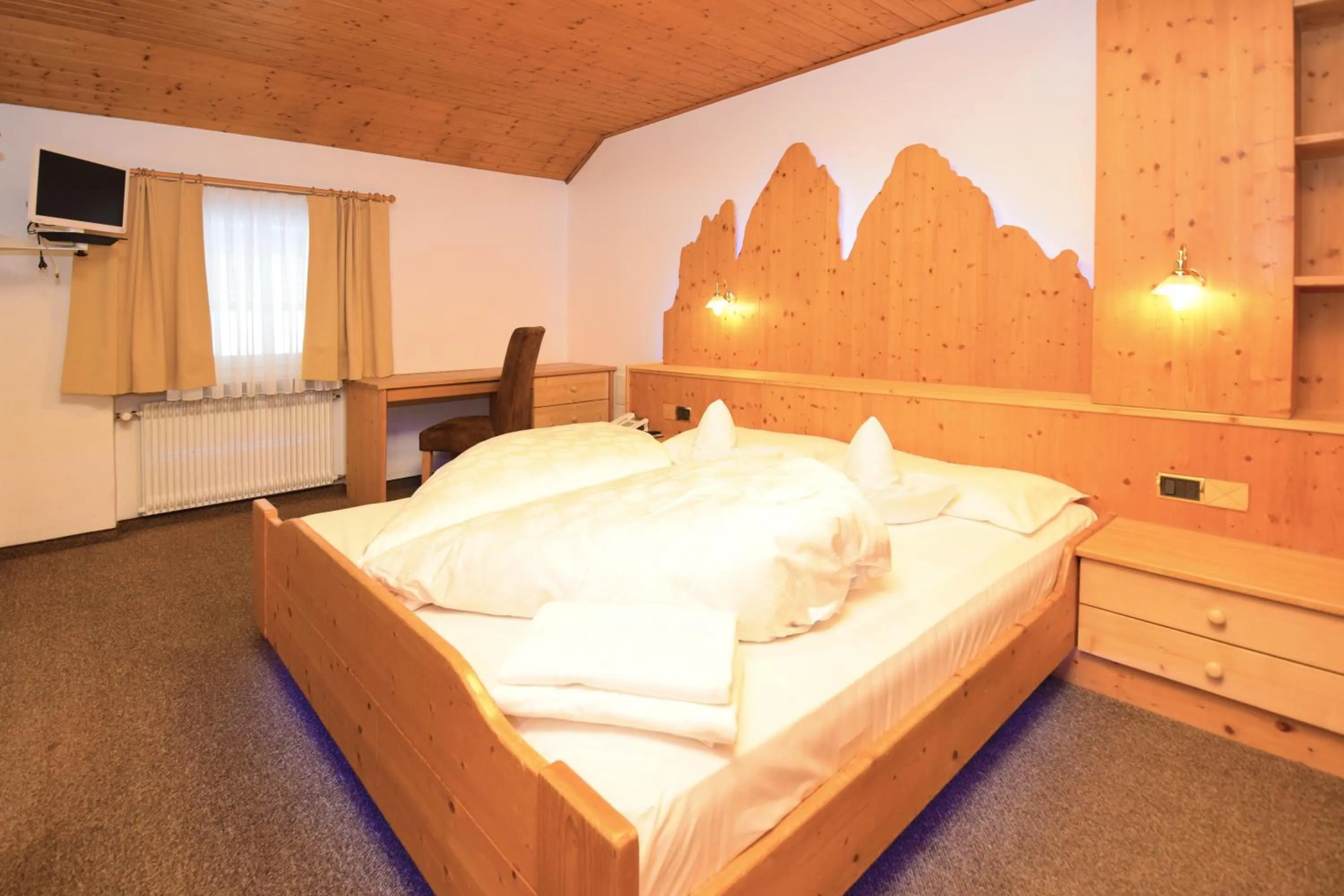 Bed in Hotel Chalet Olympia