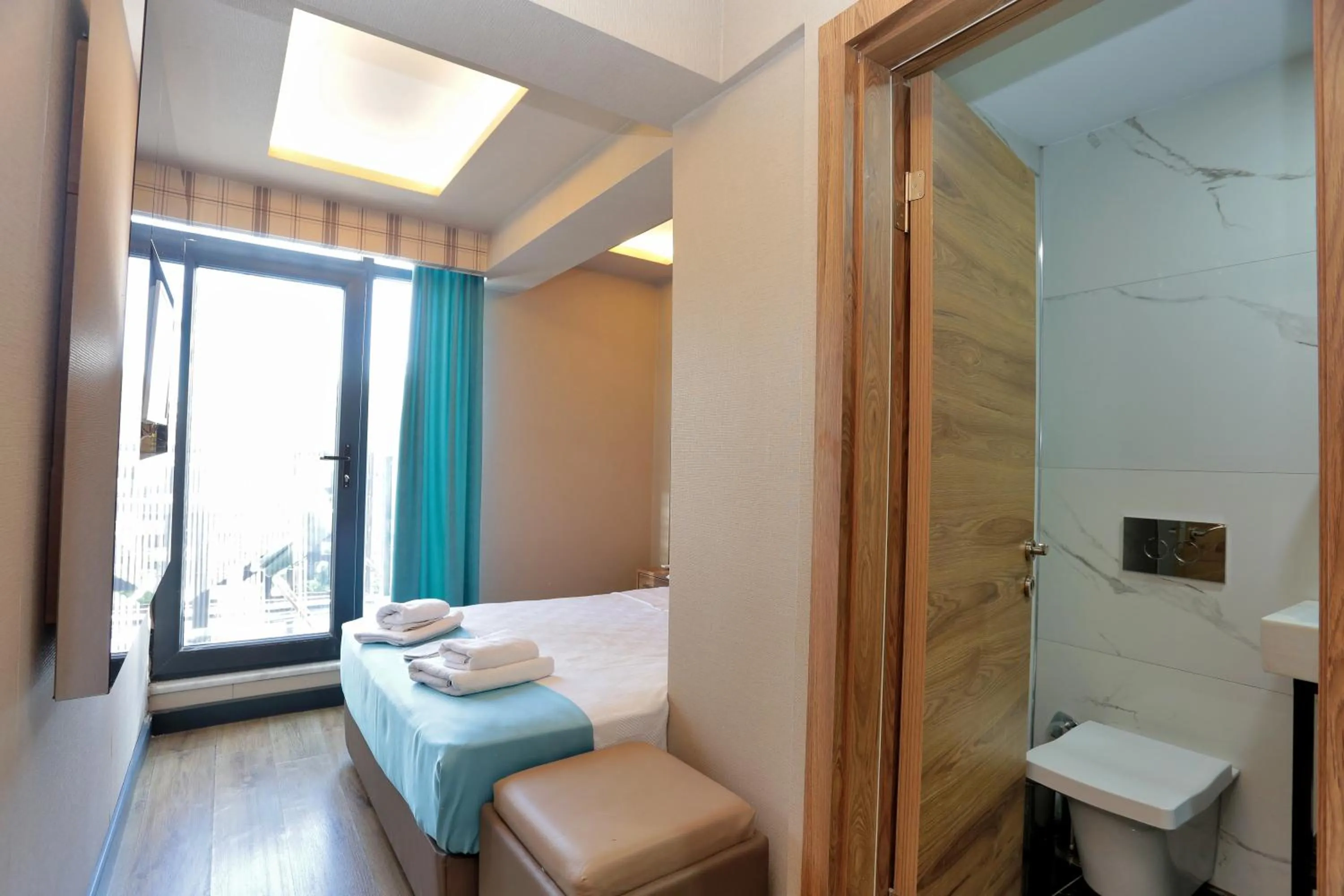 Shower, Bed in Turkuaz Hotel